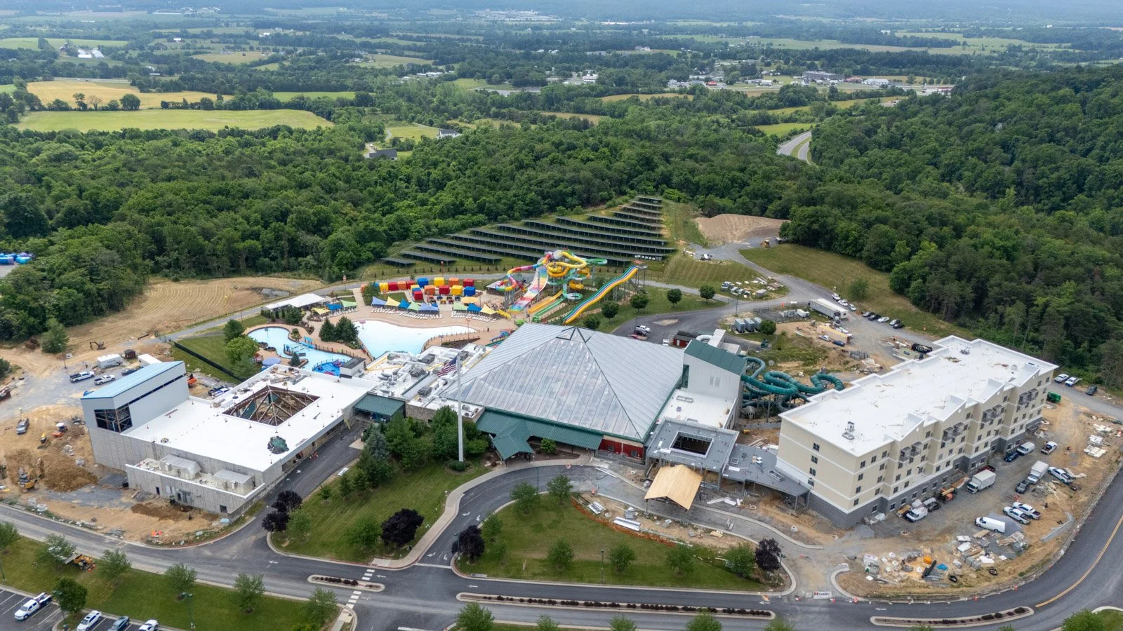 Insulated metal panel cladding on the waterslide tower at Massanutten Water Park with the Shenandoah Valley mountains in the background