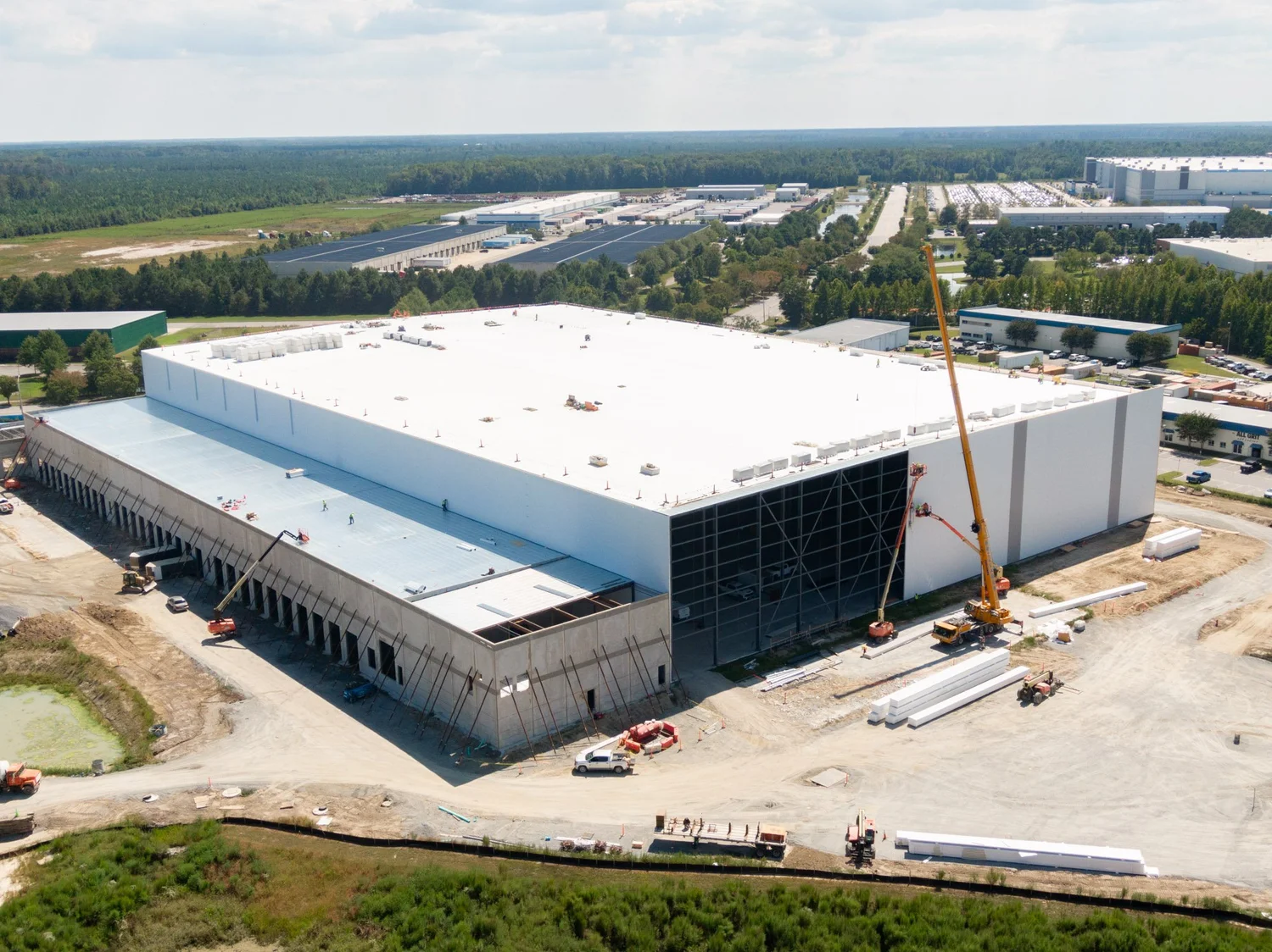 Aerial view of the FreezePak building under construction with a crane on site