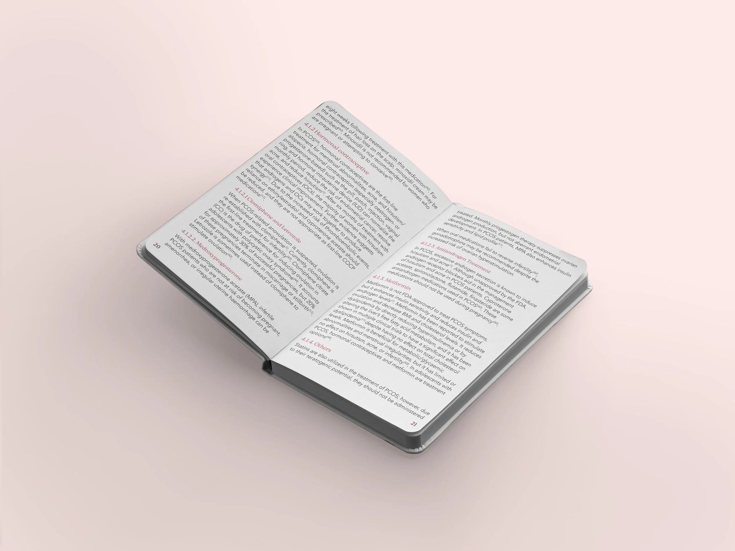 Open PCOS notebook with medical or scientific text on a light pink background.