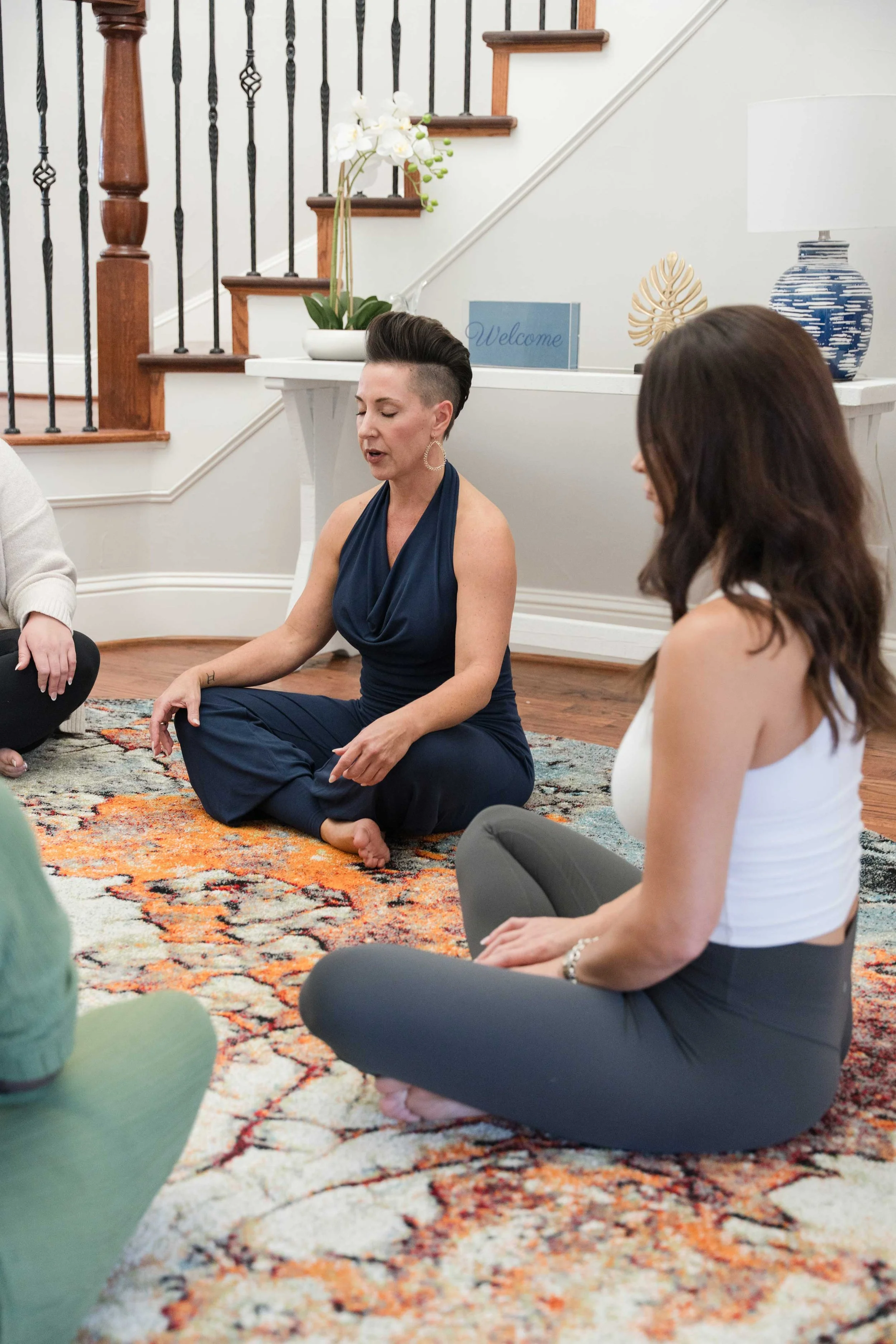 Emotional healing moment showing a woman releasing and processing deeply held grief during VIP retreats for divorced women by JenMG, sex and relationship coach.