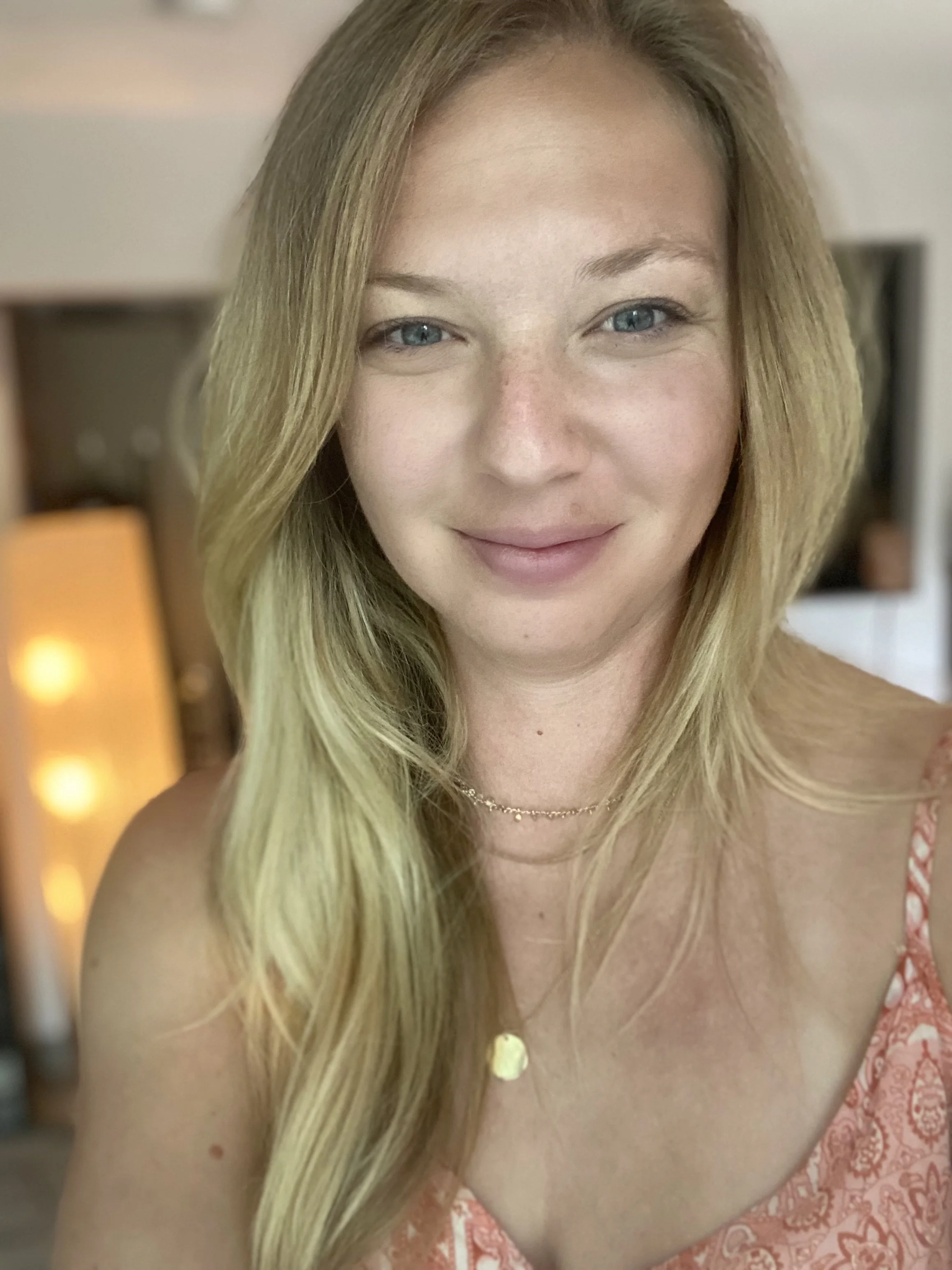 Michelle Fagan, LPC who provides holistic therapy services smiling at the camera