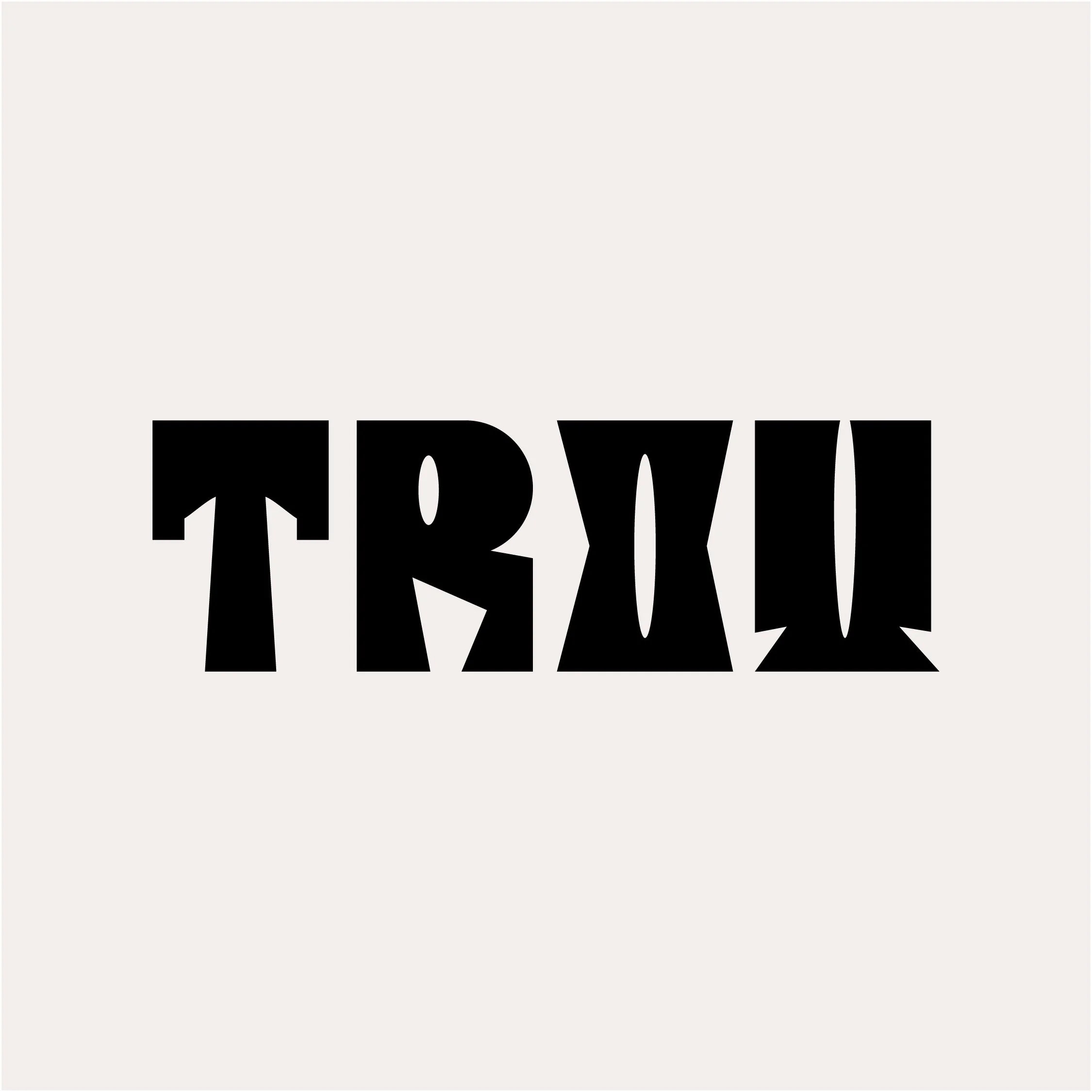 Close-up of bold black text on a white background, partially visible, spelling out 'LOVE'.