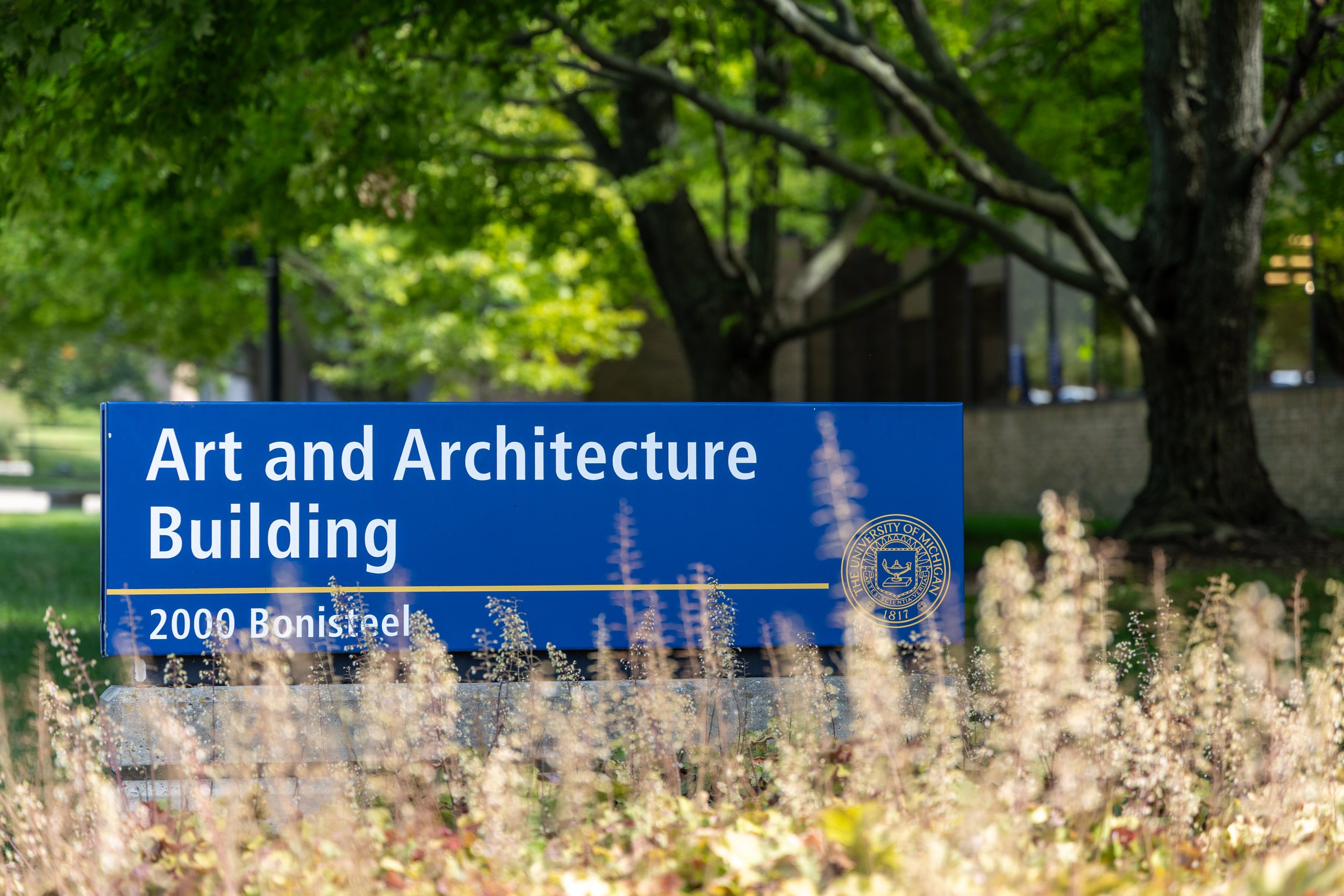 A blue sign with the writing "Art and Architecture Building" written on it