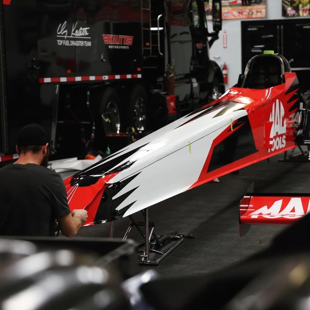 A dragster being vinyl wrapped