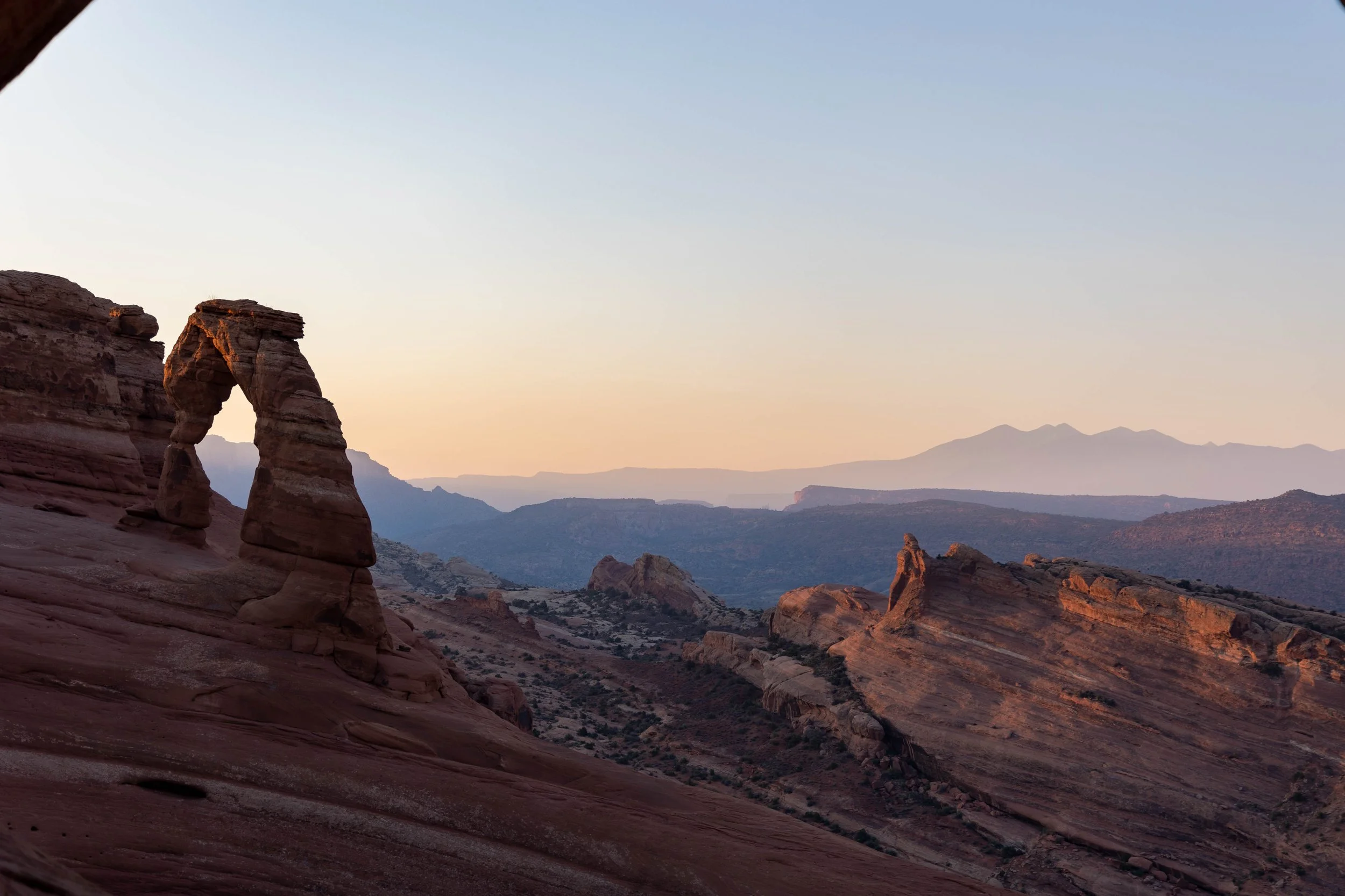 A morning sunrise at Arches National Park in Arches Utah featuring the Arch.