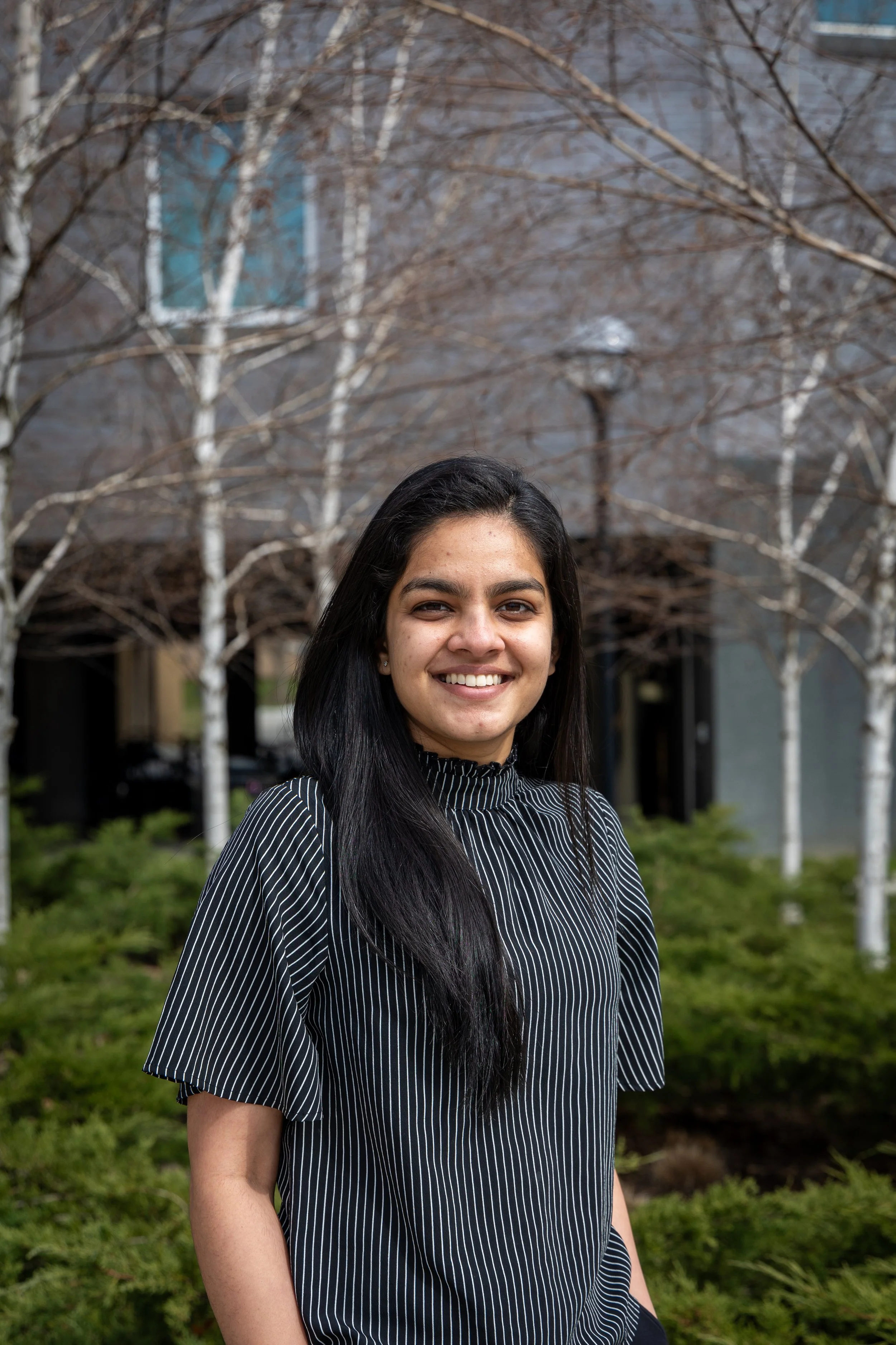 A woman poses for the camrea with a nice smile