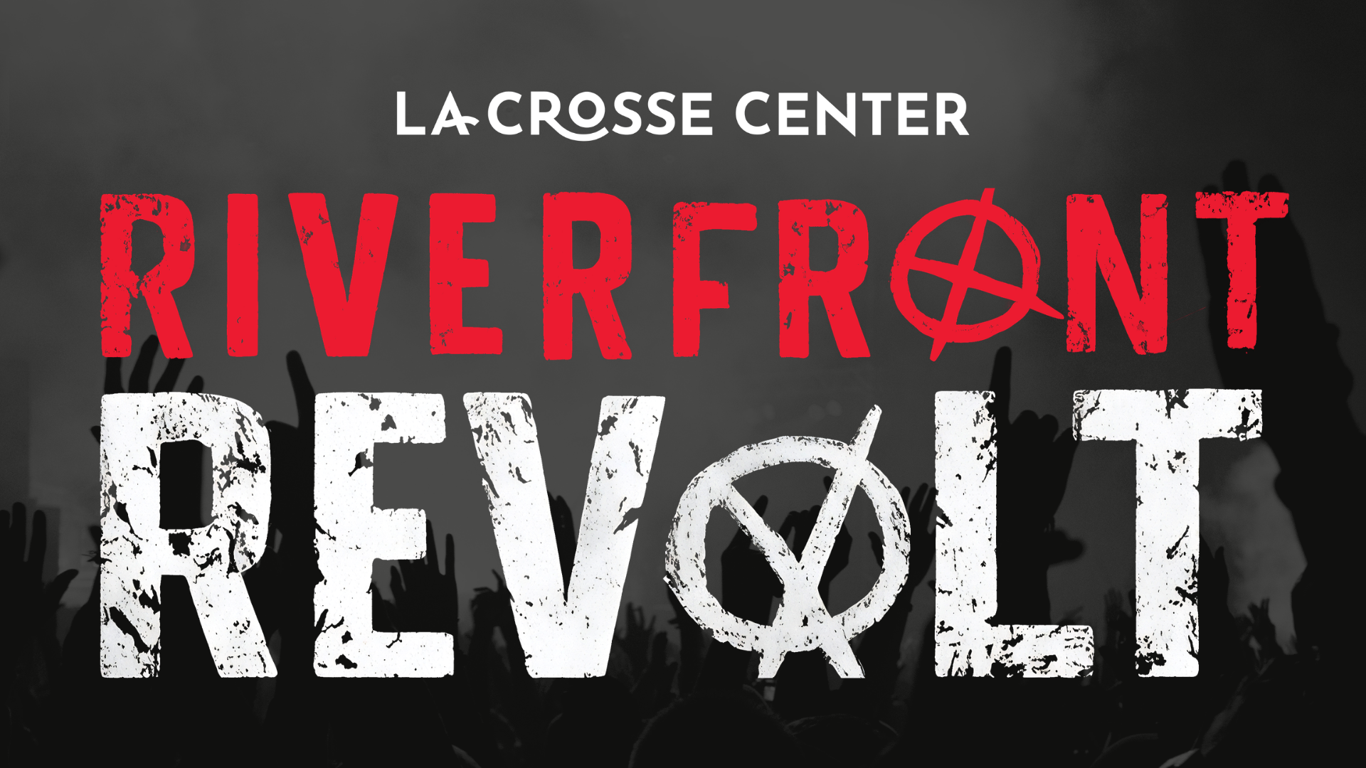 Graphic for the La Crosse Center’s Riverfront Revolt festival featuring bold red and white distressed text over a dark concert crowd background with raised hands, creating a high-energy rock and festival atmosphere.