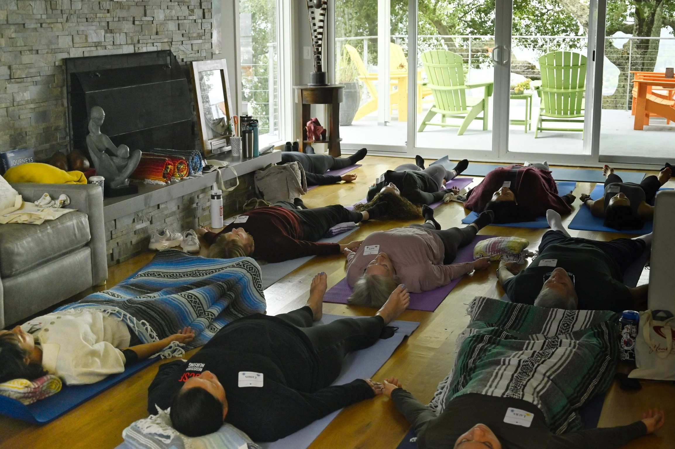 Group on mats in living room.JPG