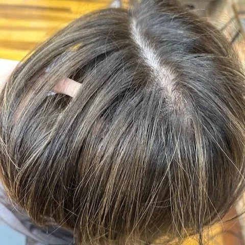 express lightening session showing toned babylights to add subtle dimension to brunette hair