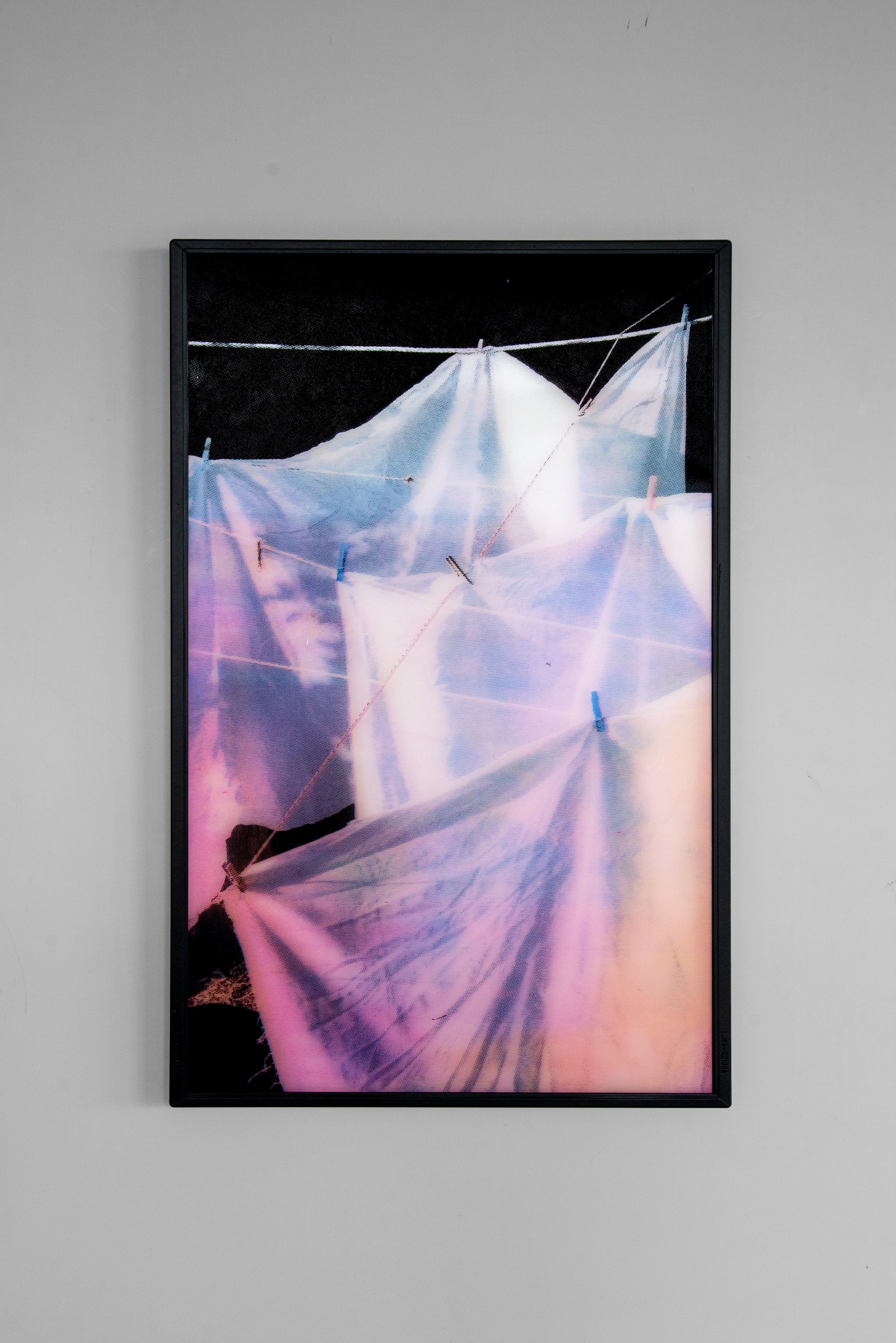 Romina Koopman, White Sheets, 2026. CMYK silkscreen, multiple layers of polarising film in a metal frame with museum glass. 49.5x32 cm