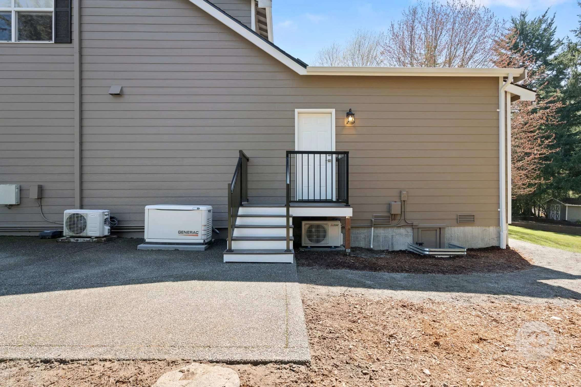Completed primary suite addition exterior back entry.