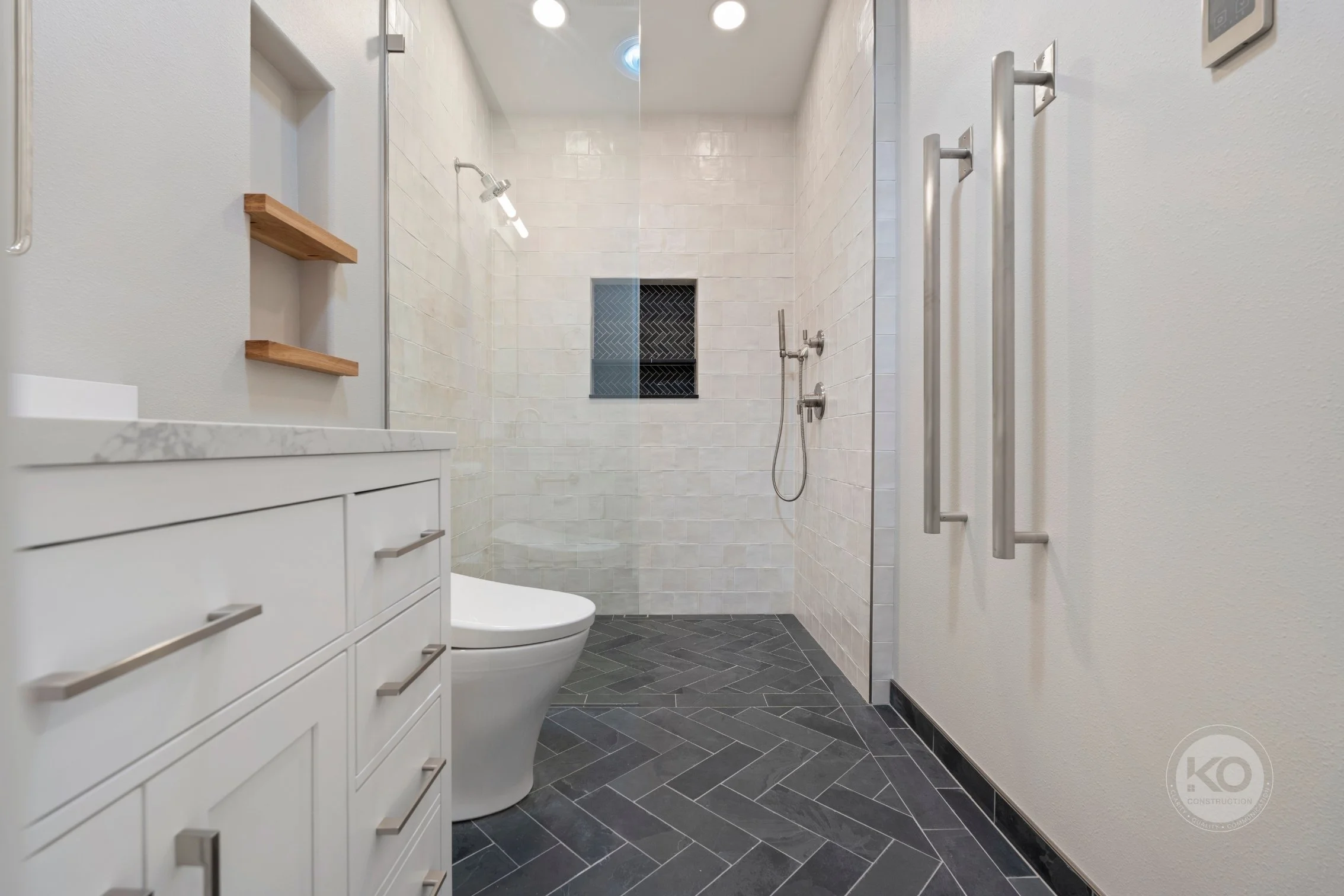 White shaker vanity and walk-in shower in custom Lake Tapps bathroom