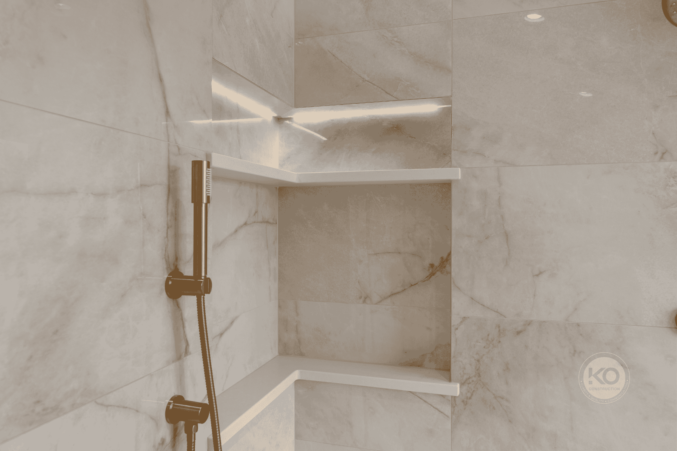 Custom shower niche with integrated lighting in a luxury primary bathroom remodel in Pierce County, WA.