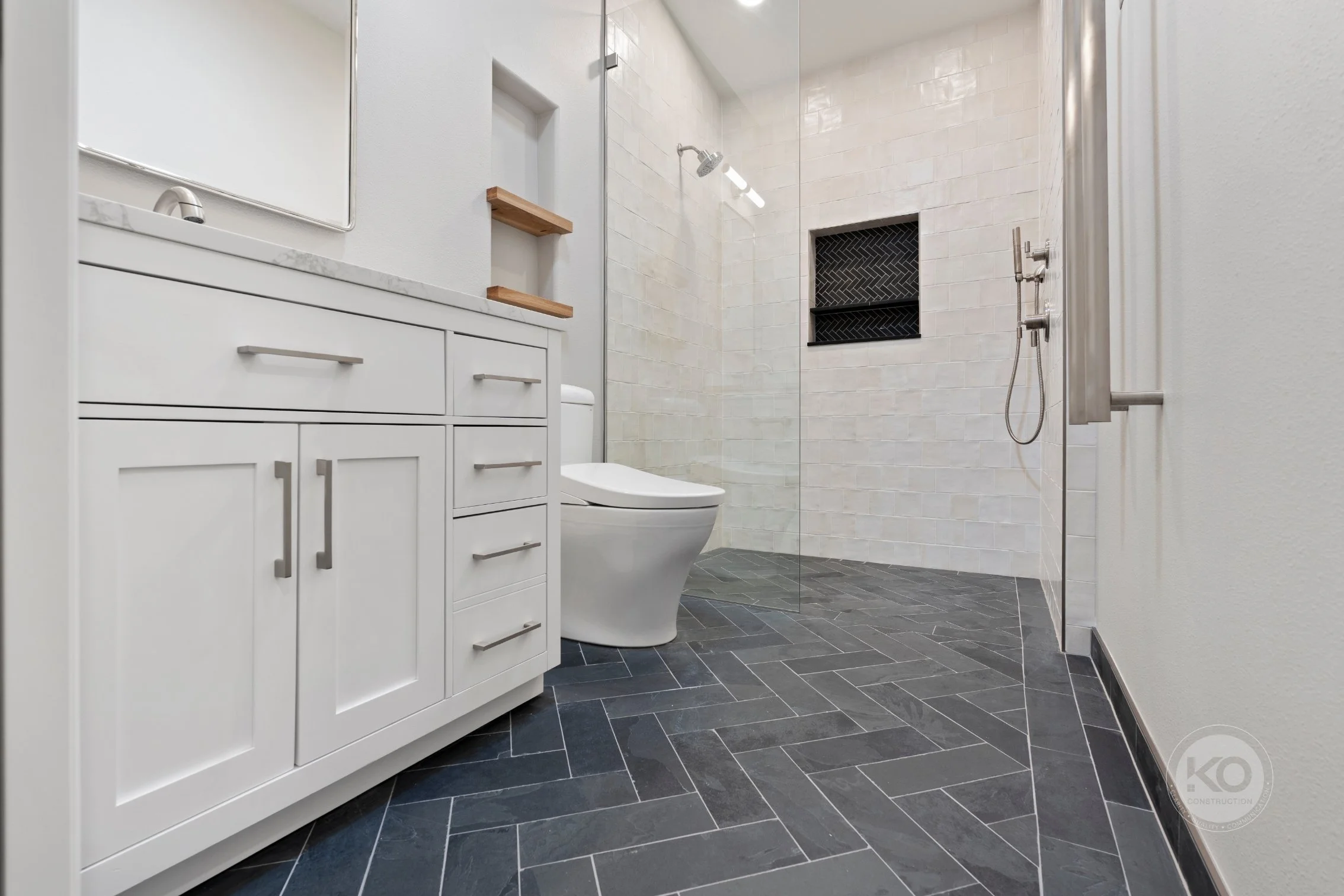 Custom ensuite bathroom with curbless walk-in shower in Lake Tapps remodel