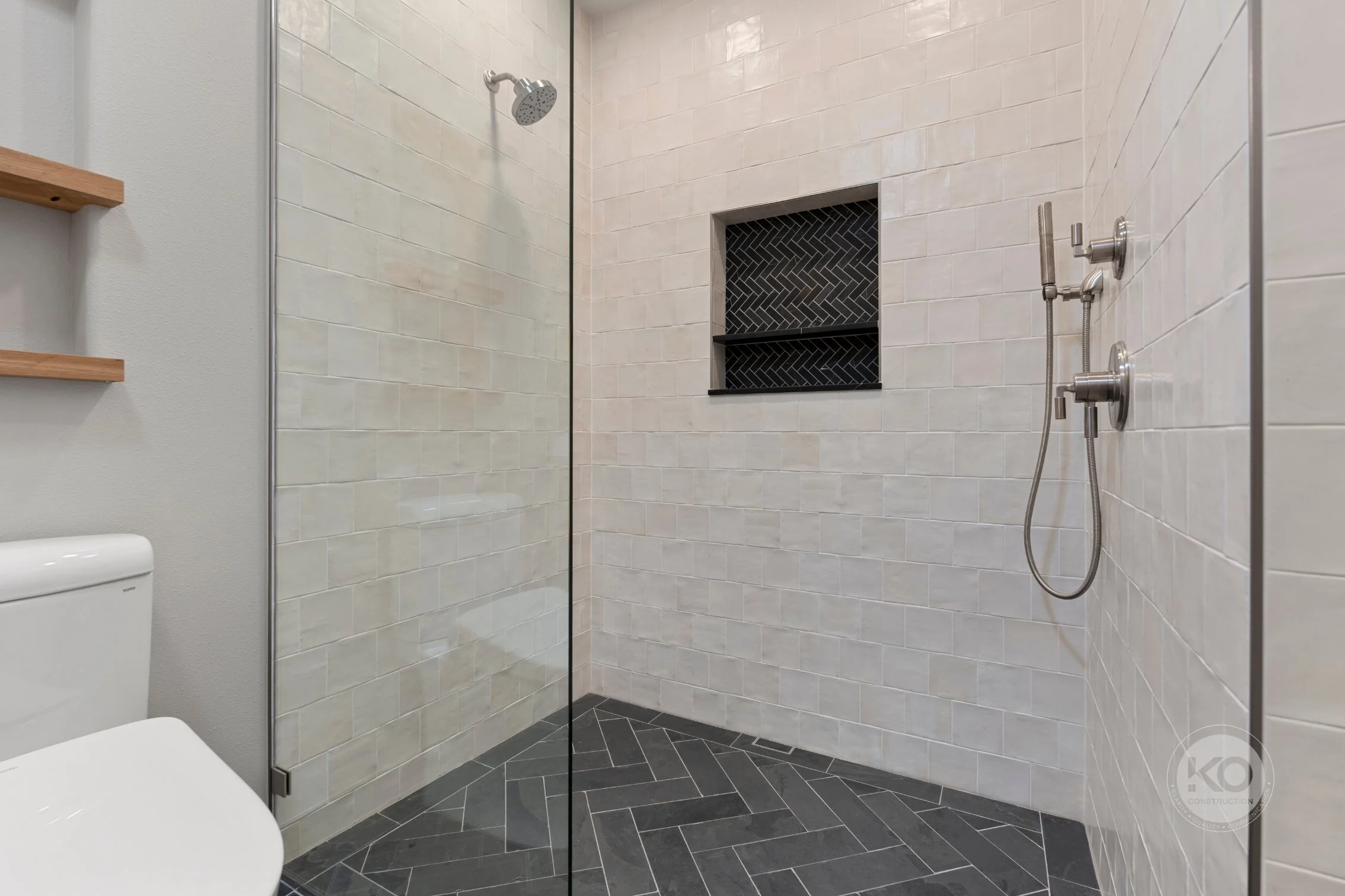 Curbless walk-in shower with custom tile in Lake Tapps primary suite addition