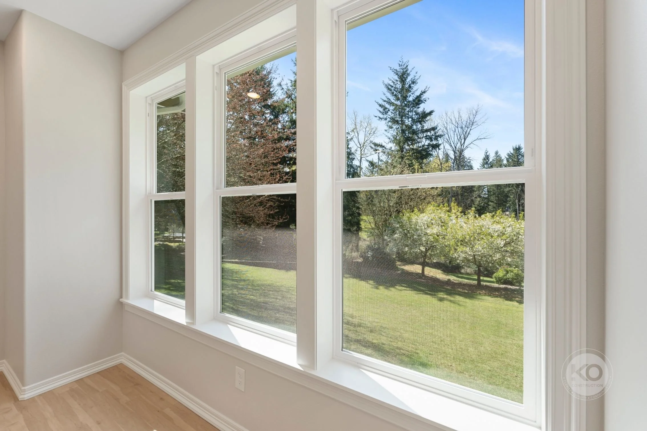 Large windows bringing natural light into a Lake Tapps primary bedroom addition