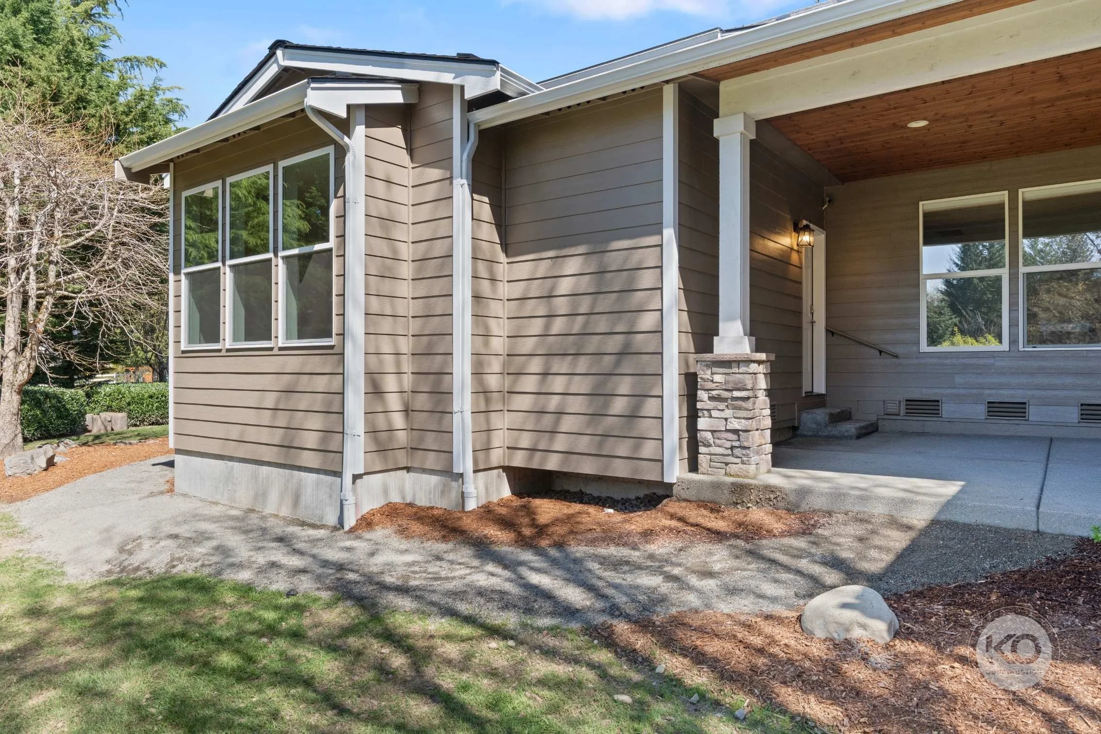 Completed primary suite addition exterior front entry.