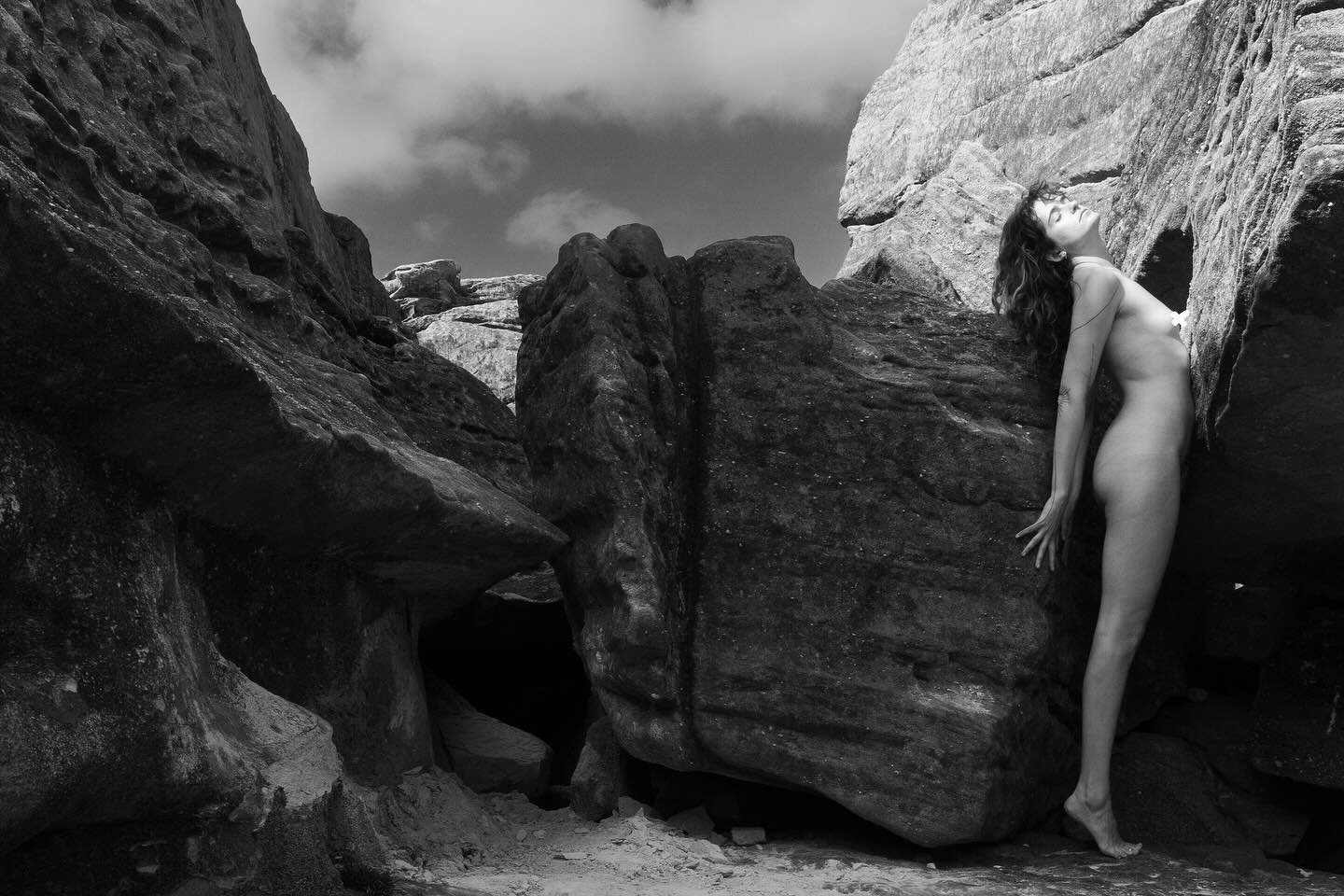 I reach for sunlight as the sea-breeze brushes past laying its salt upon my skin. #blackandwhitephotography #nudeportrait #photography #selfportraitphotography