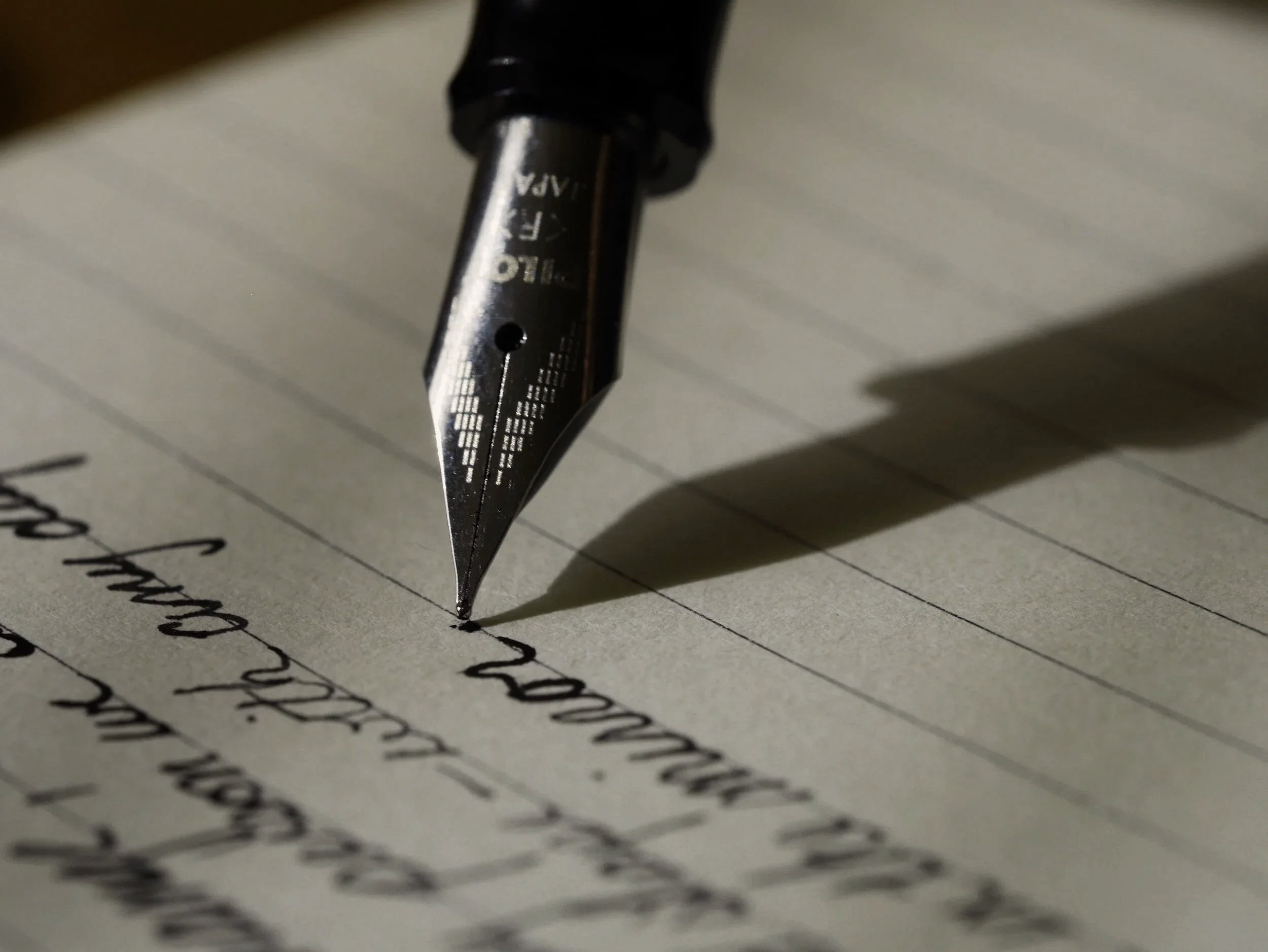 Fountain pen writing on official document, representing certified translation in Vancouver, Canada (Chinese to English, STIBC & ATIO)