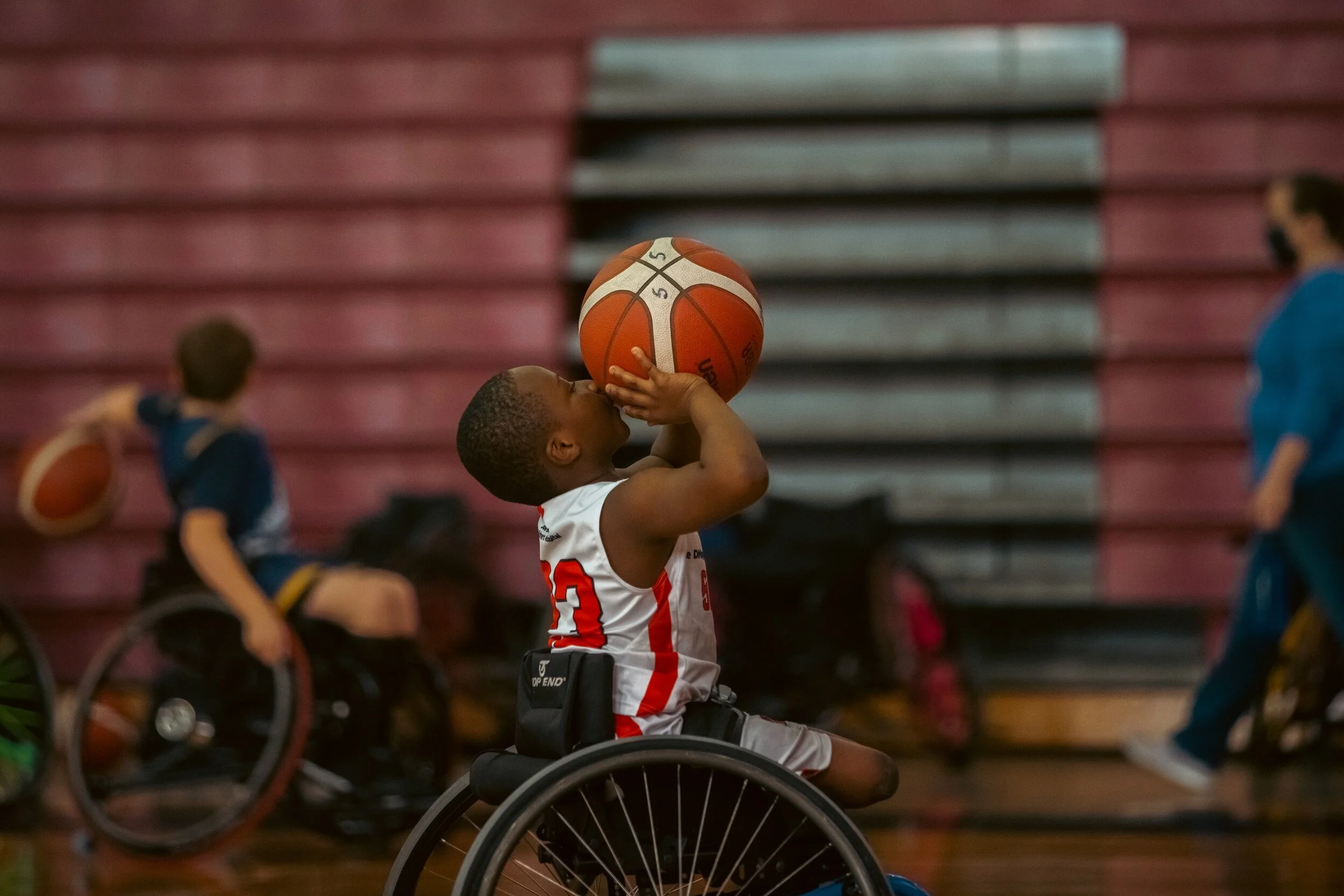 A child playing sport in a wheelchair