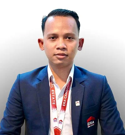 A man in a blue suit and white shirt wearing a lanyard with 'ERA' and 'STATE' written on it