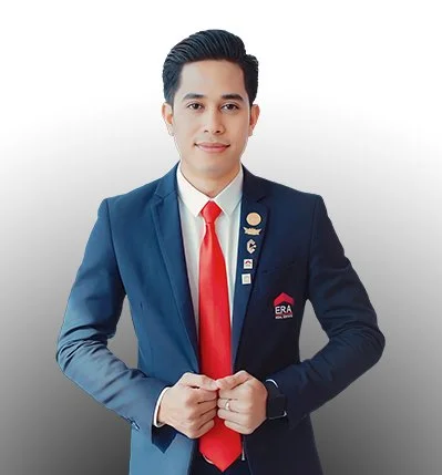 Young man in a navy blue suit with a red tie and ERA pin, standing against a white background.