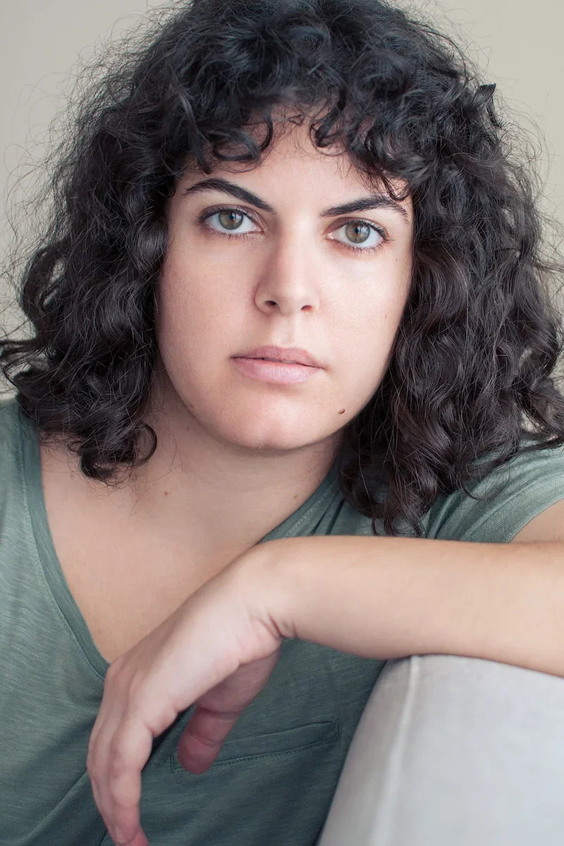 gallery_woman_curlyhair_green_top.webp