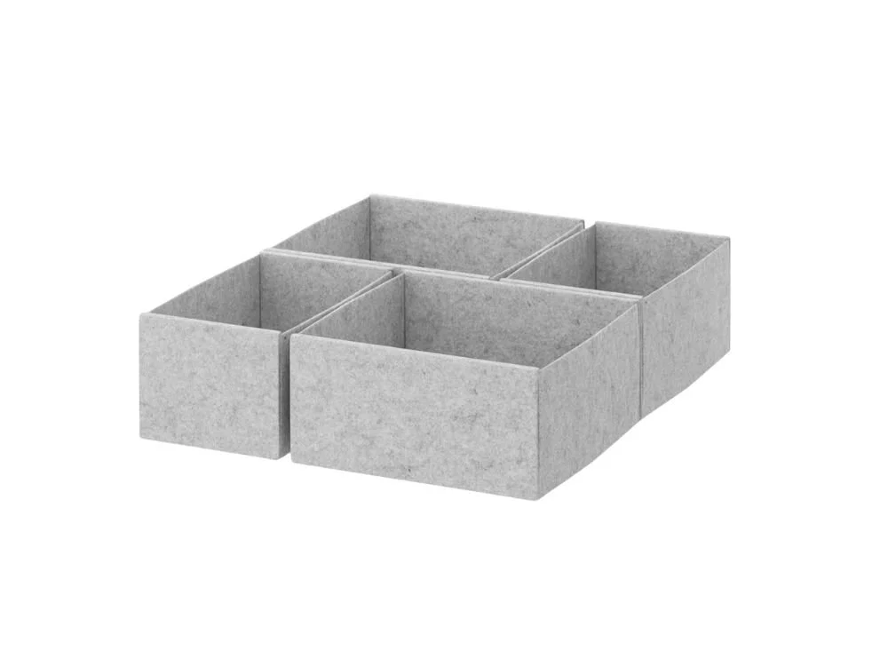 Vier grijze vilten opbergdozen in verschillende maten