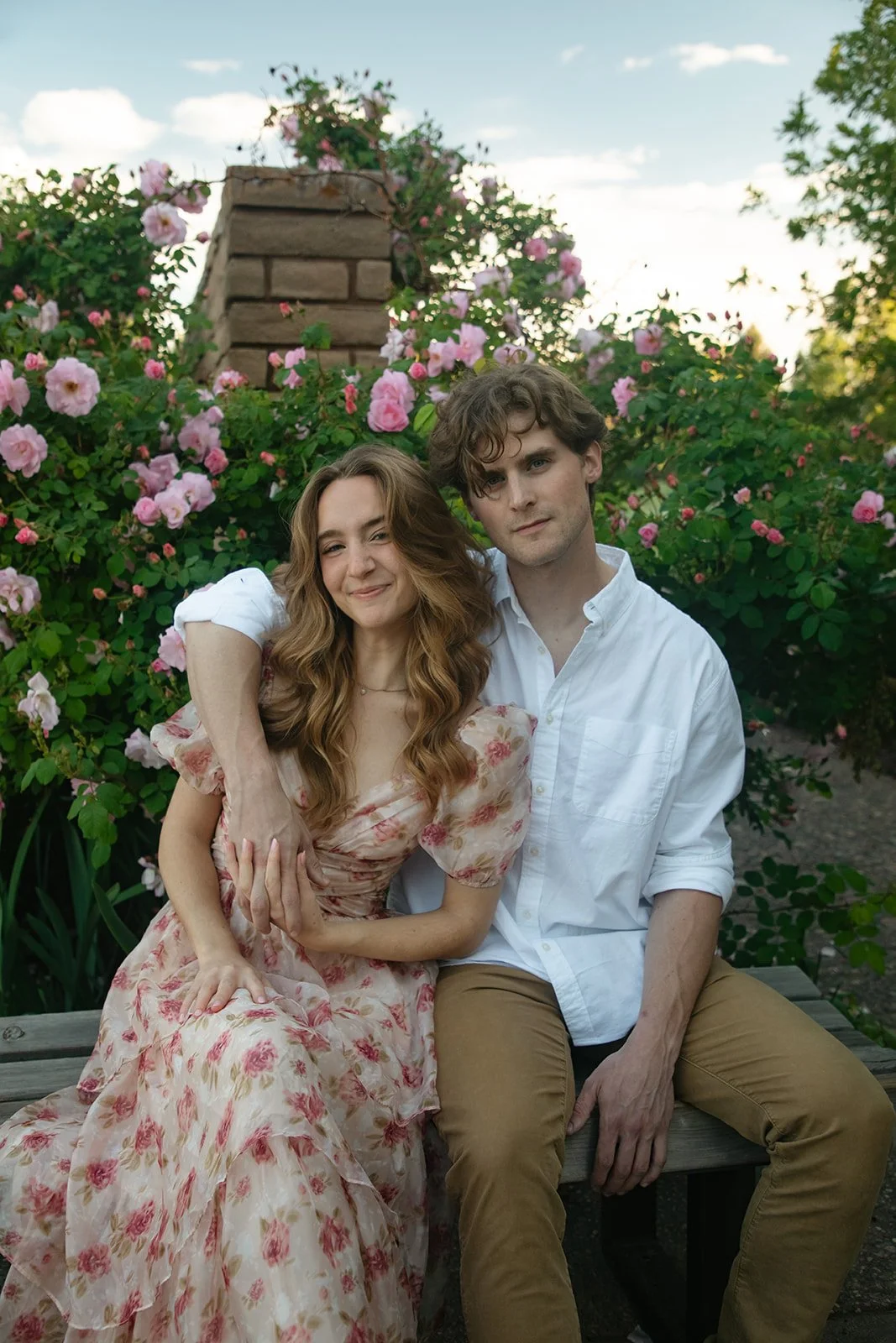 newly engaged couple posing for the camera, taken by a Denver engagement photographer