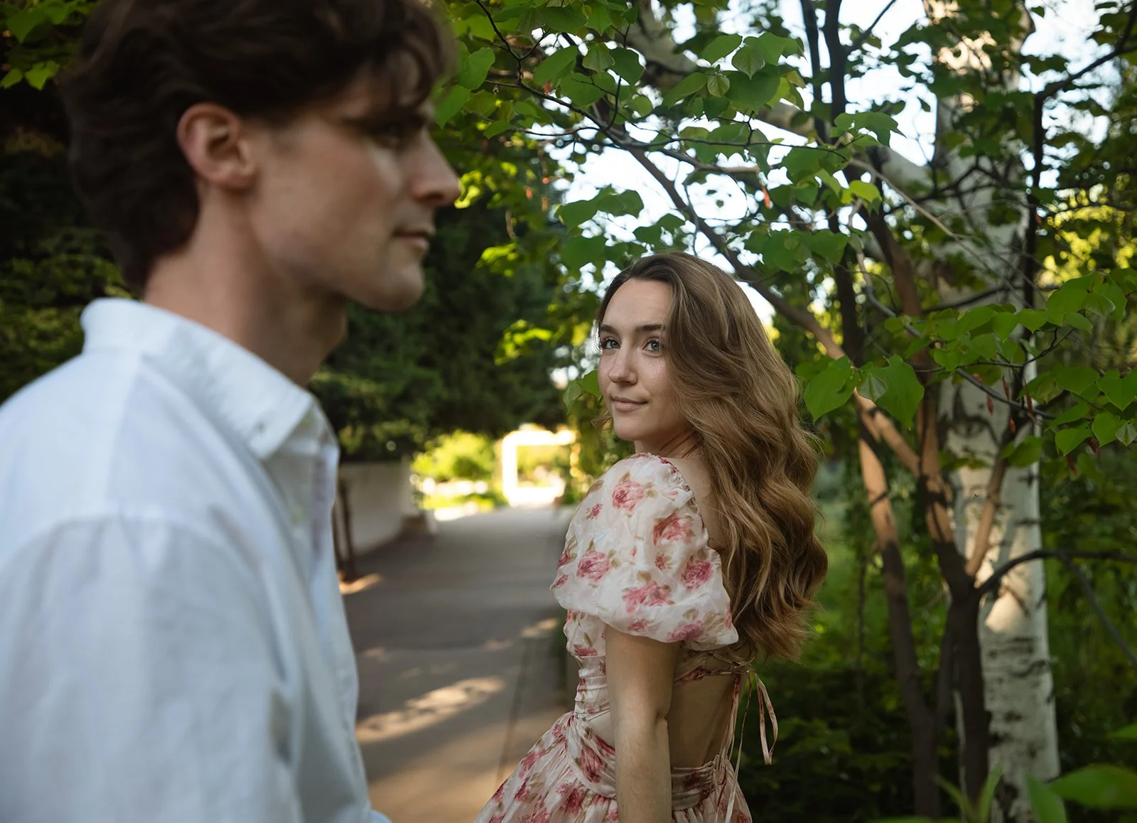 a woman looking at a man during Denver engagement photos