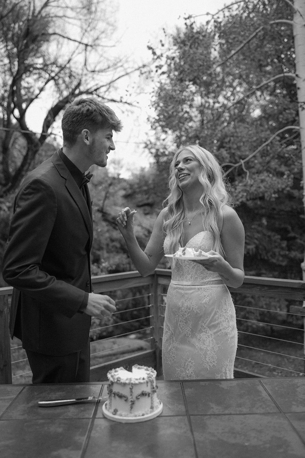 newly weds eating their elopement cake in CO