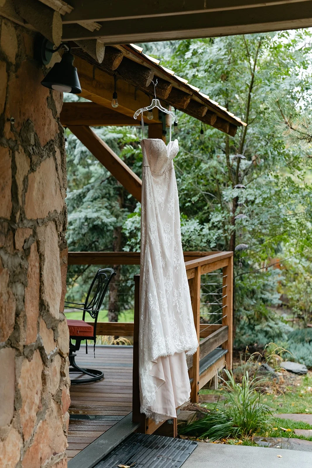 a bride's dress hangin up at their micro wedding venue