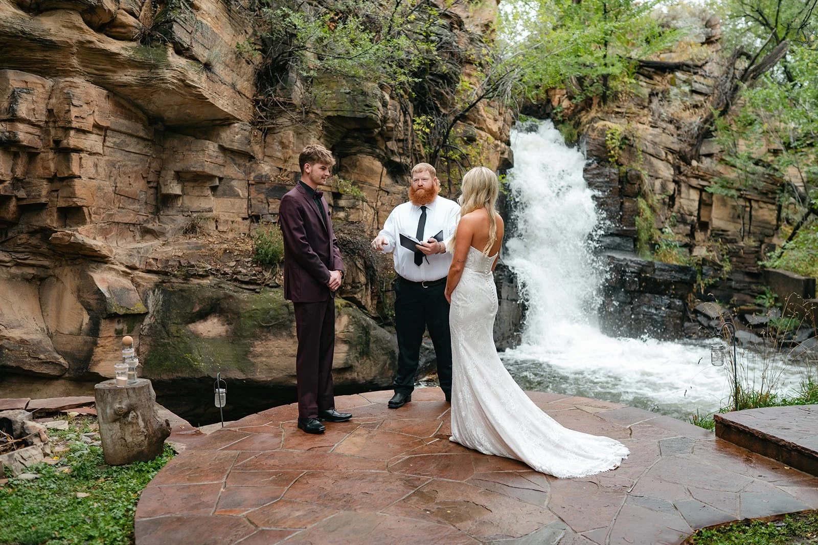 bride and groom during their waterfall elopement ceremony at a micro wedding venue