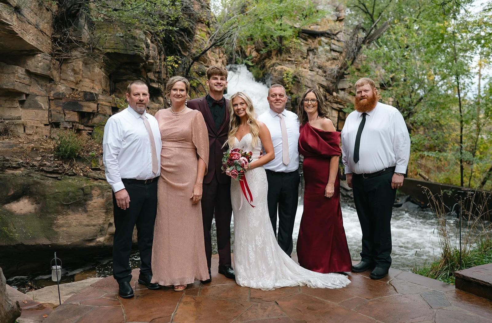 bride and groom and their familys after their micro wedding venue elopement