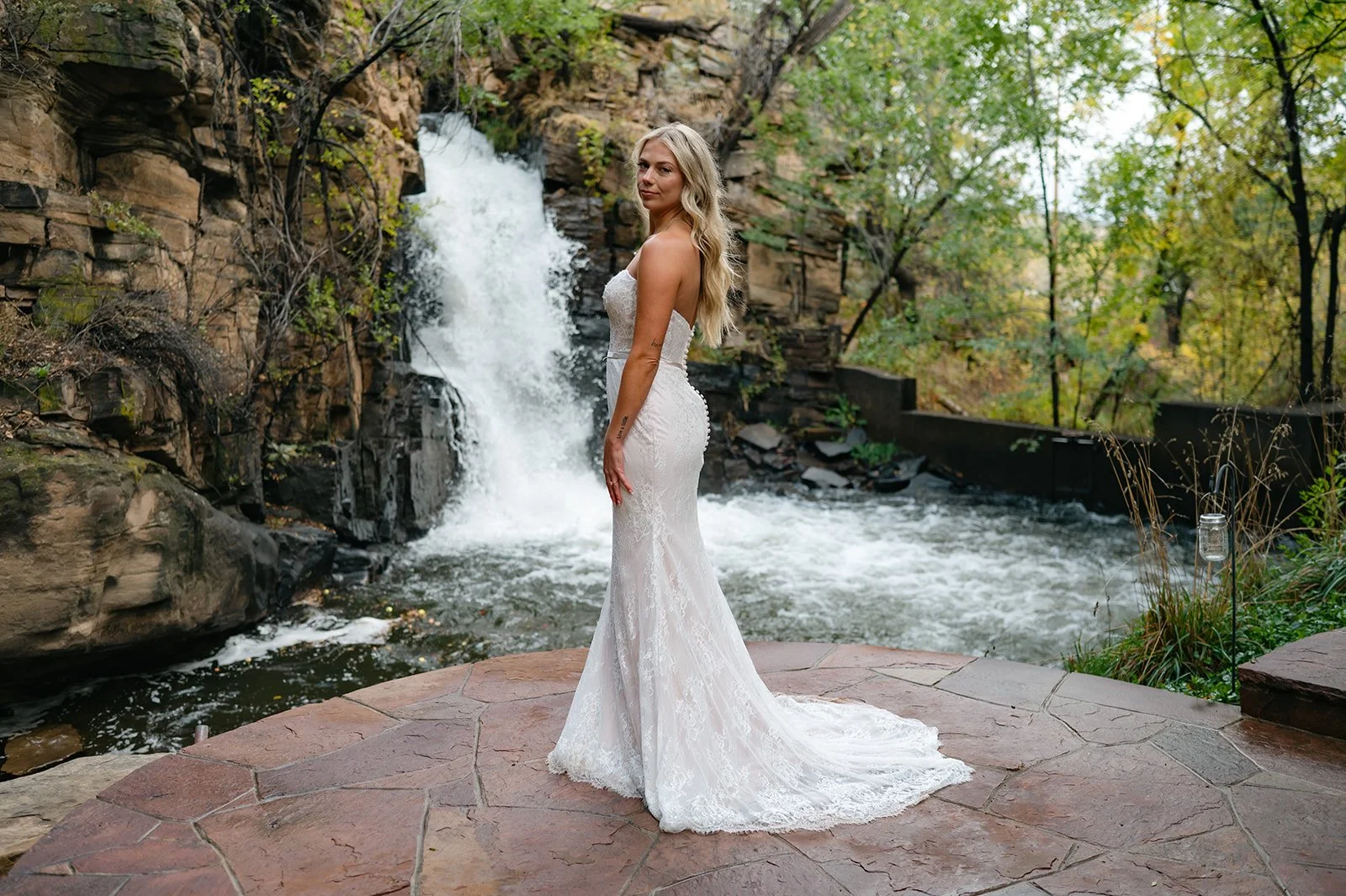 bridal portrait in front of a waterfall in Colorado
