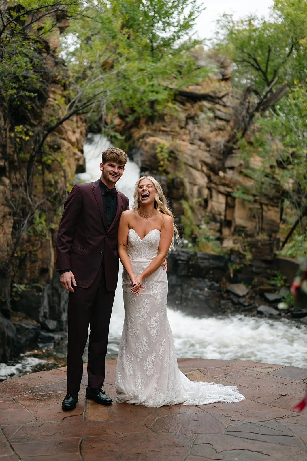 the bride and groom laughing together at their ceremony at a micro wedding venue