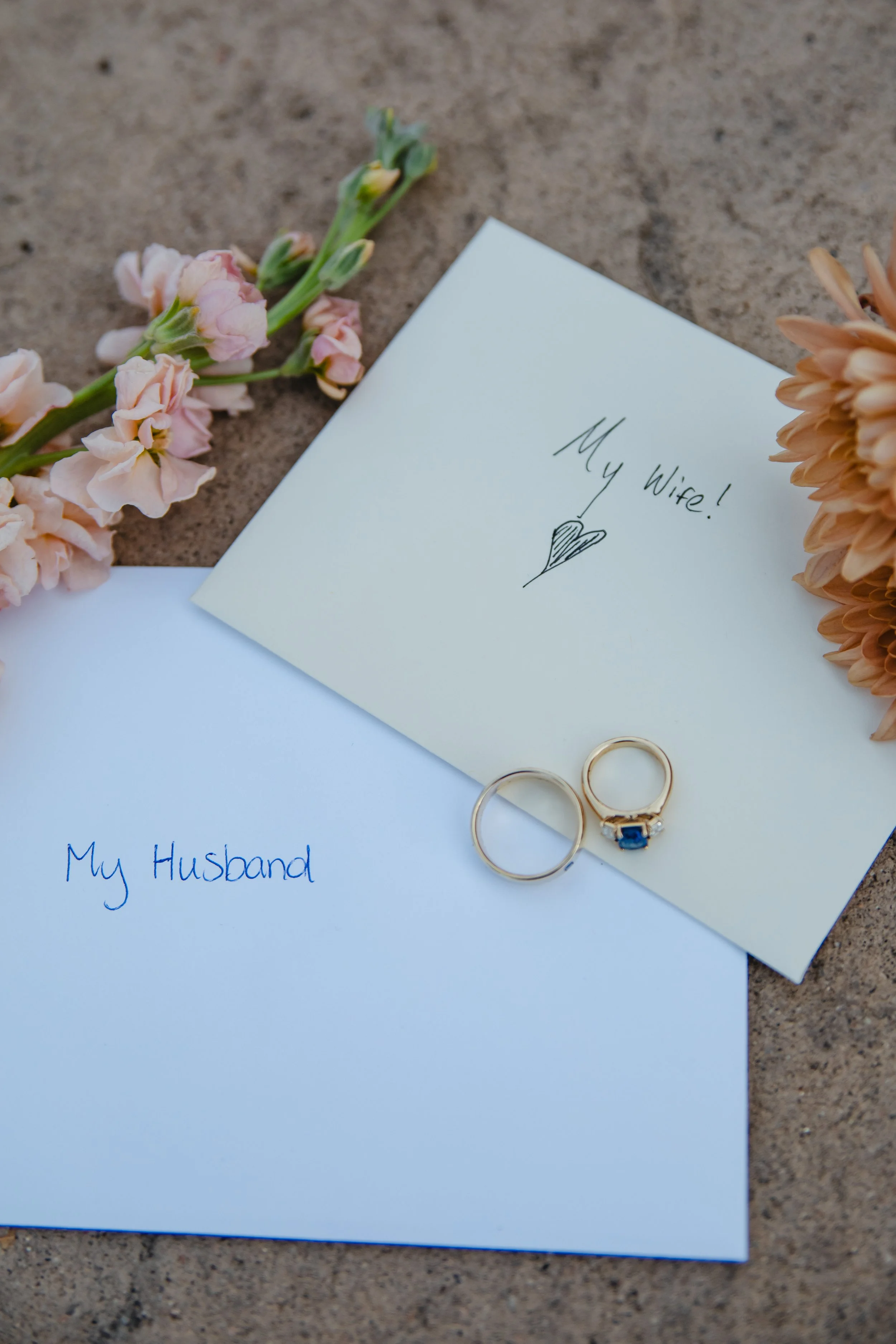 hand written letters to husband and wife with florals and their rings for Wedding Detail Photos
