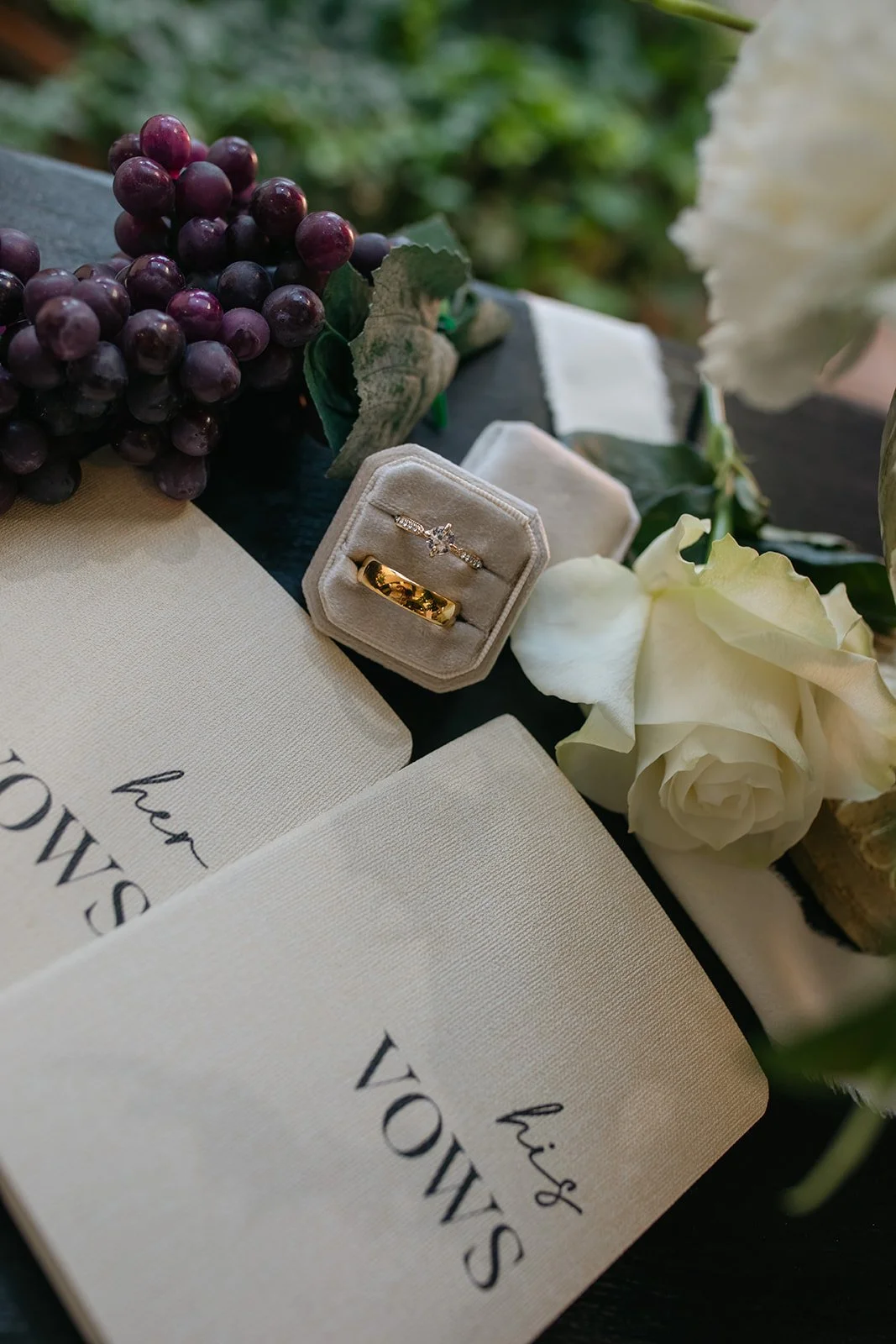 a flatlay with grapes and florals 