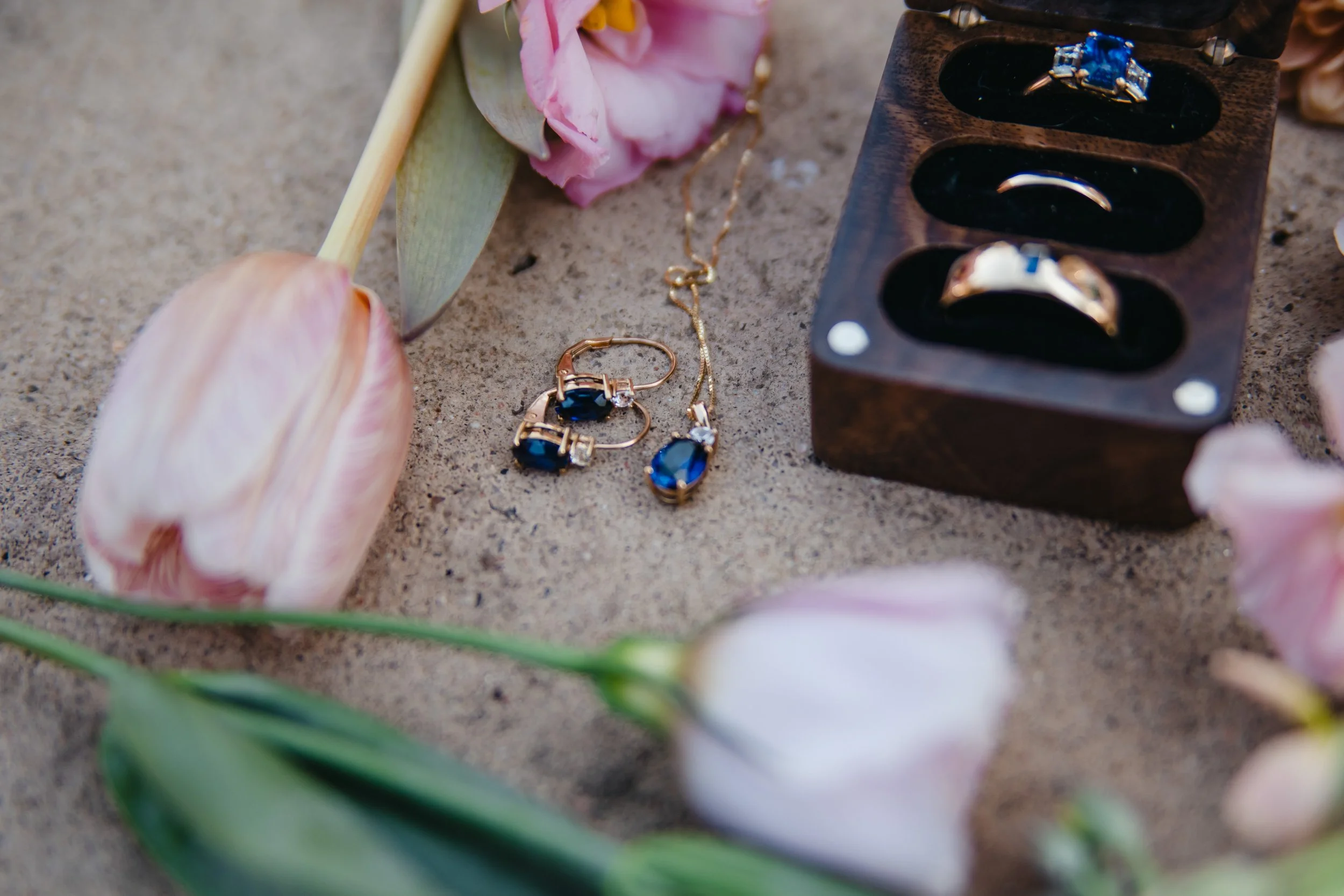 tulips and the bride and groom's jewelry laid out for Wedding Detail Photos