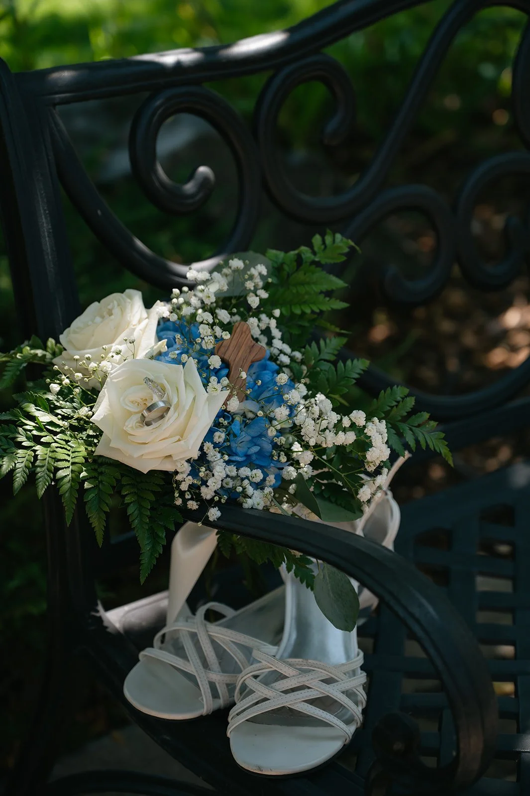 bridal bouquet and her heels sitting on a chair