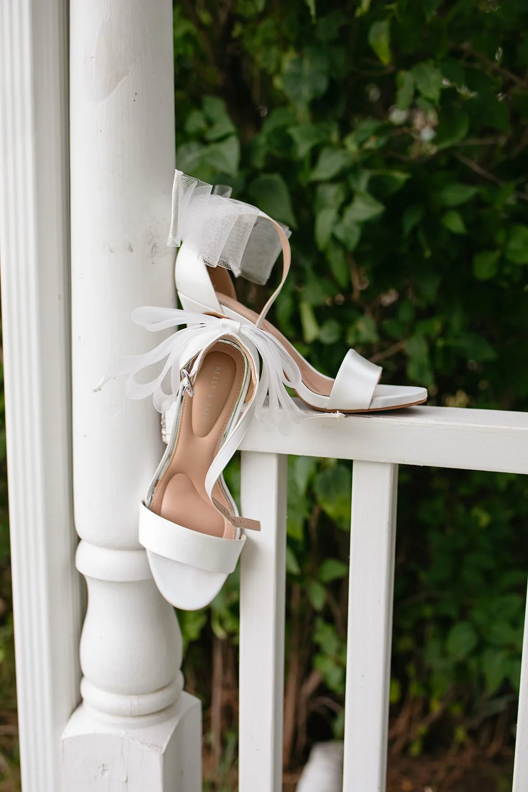 bridal heels on a railing for Wedding Detail Photos