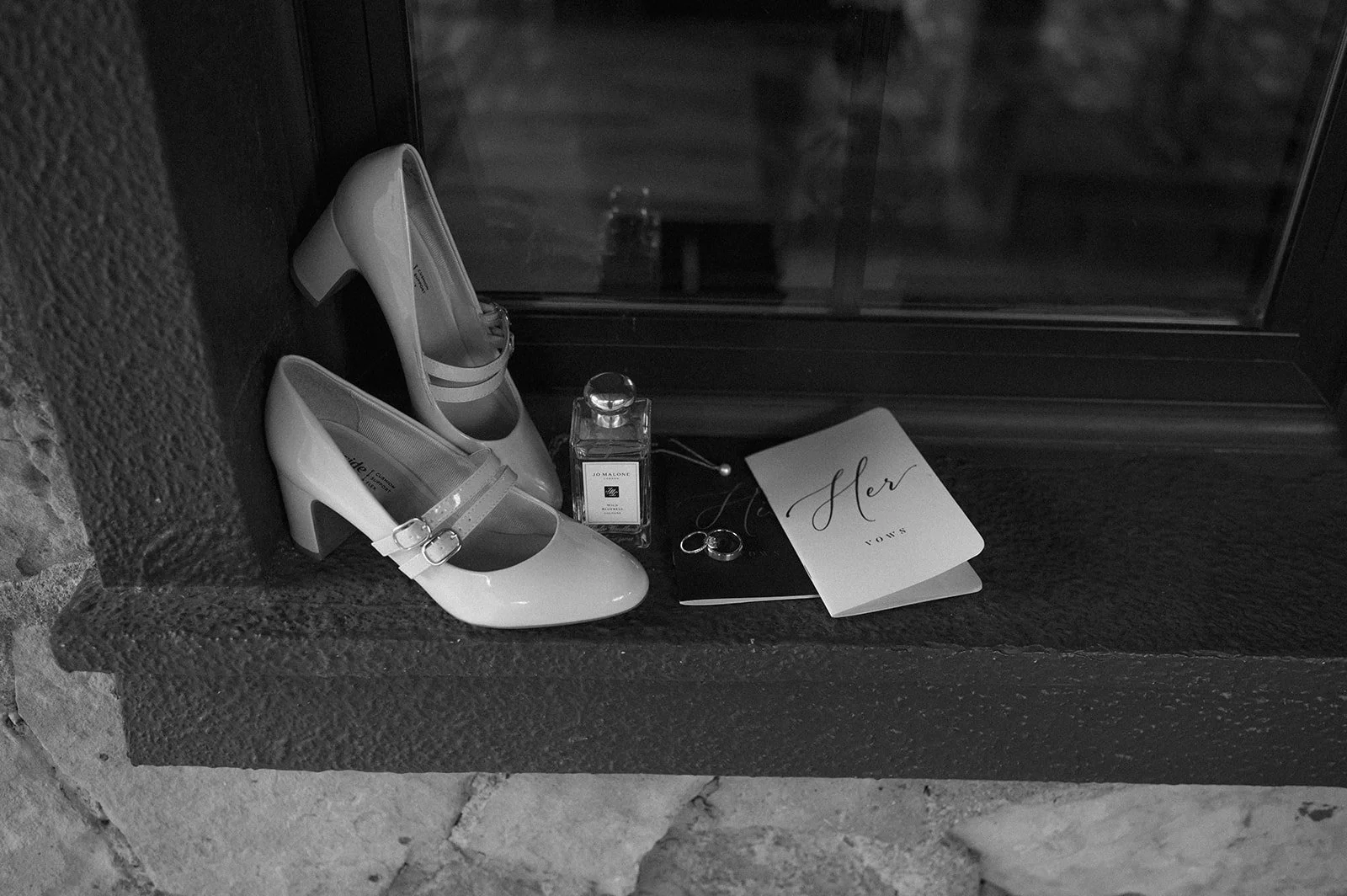 black and white of the bride's details on a window frame