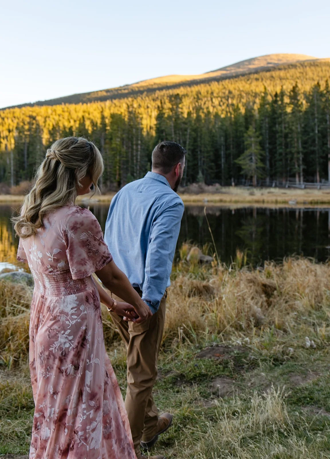 a couple walking by echo lake for their engagement photos