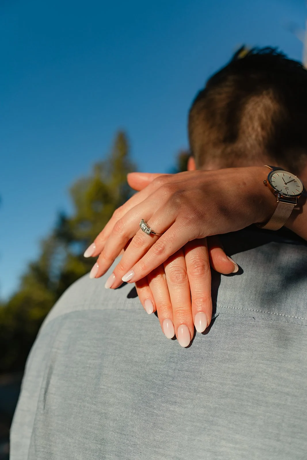 a woman's hands and her engagement ring up close
