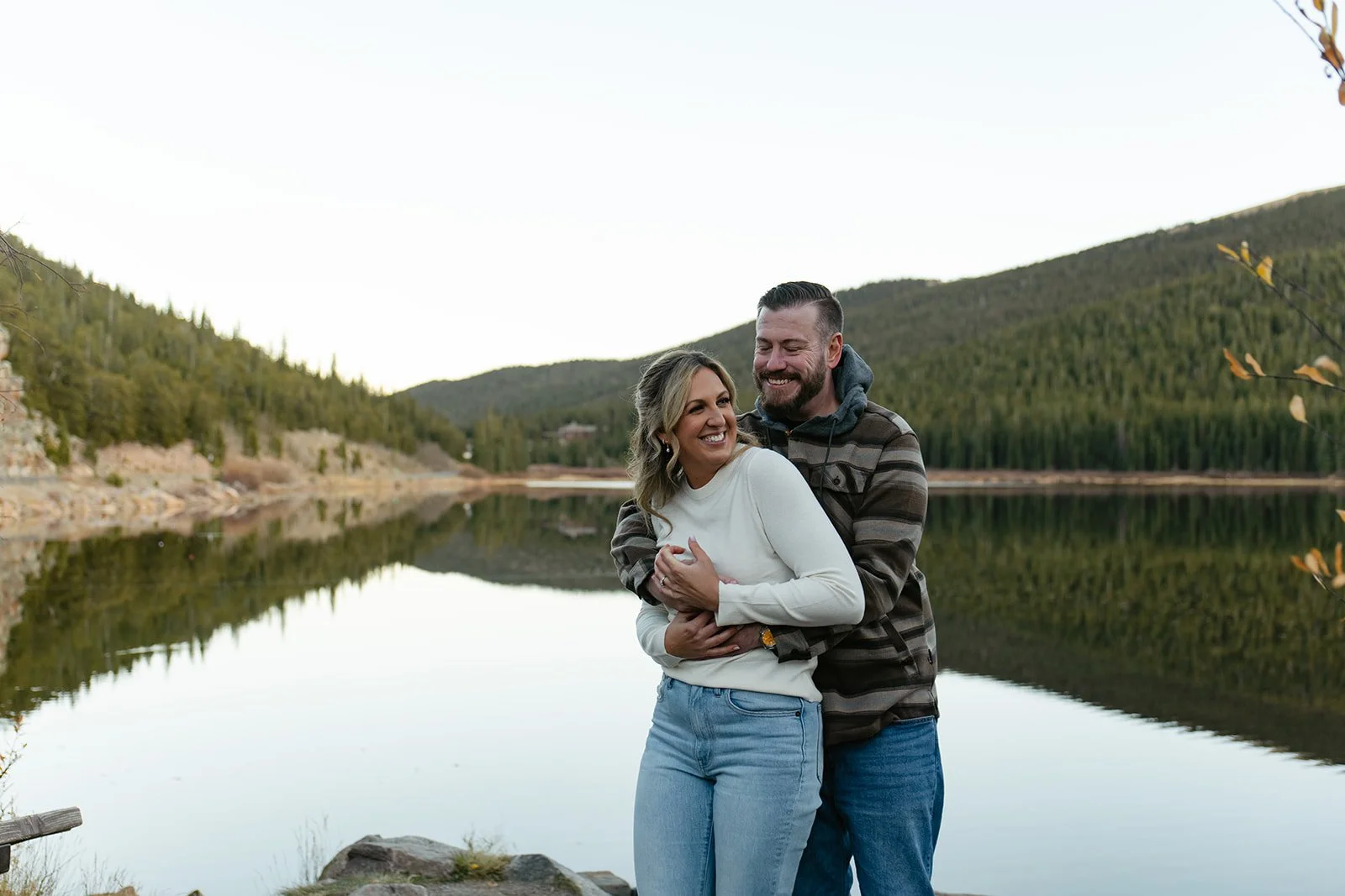 a man hugging a woman during their echo lake engagement photos