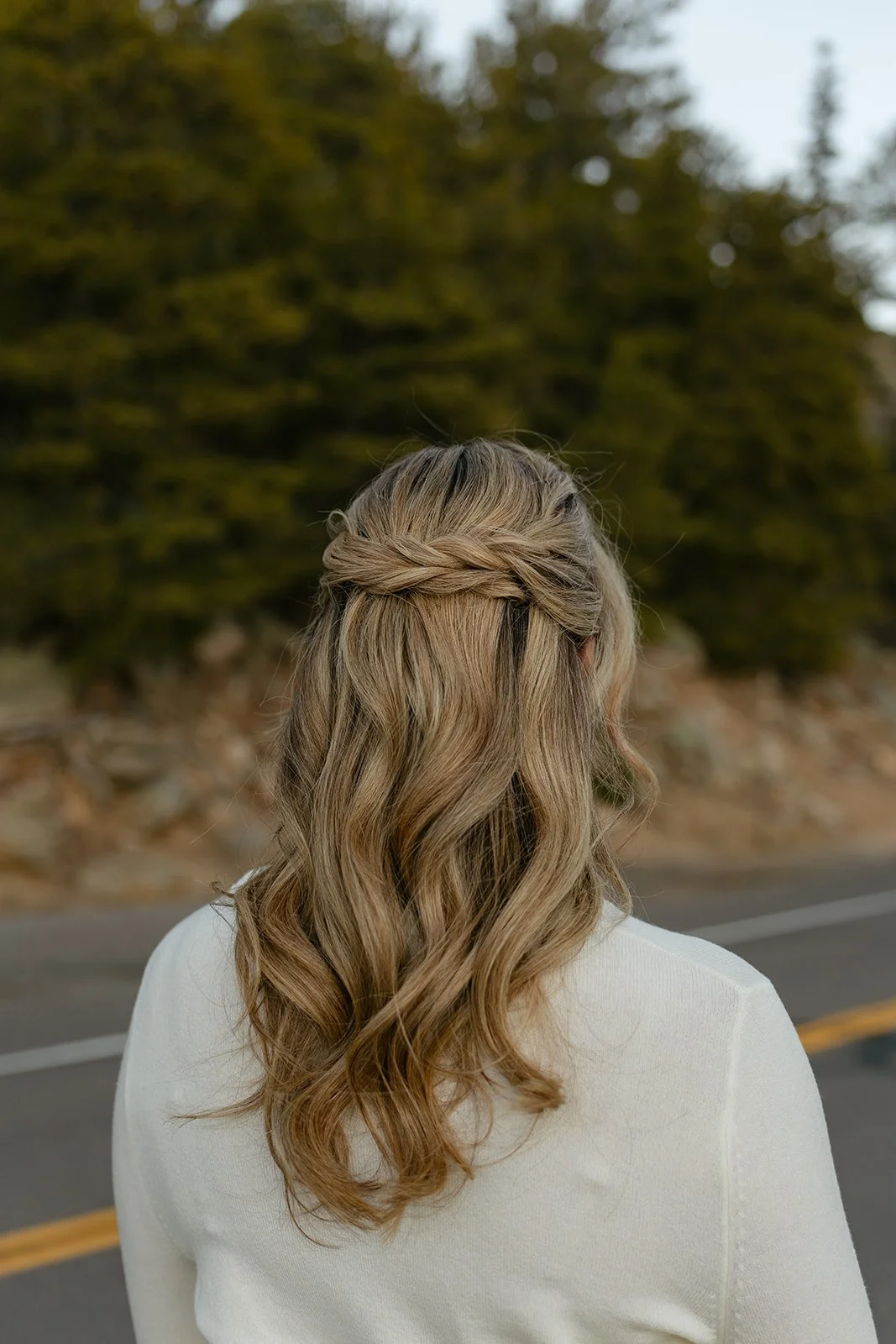 a woman's hair professionally done for her engagement photos
