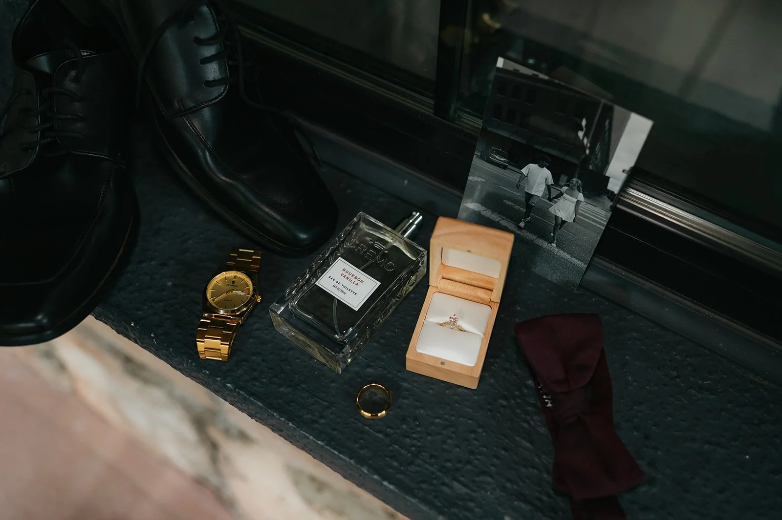 a flatlay with a lot of the groom's details for Wedding Detail Photos