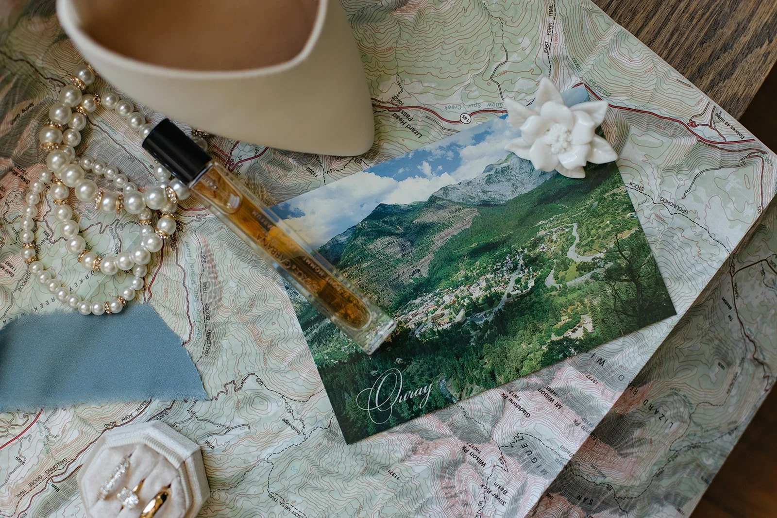 a bride's wedding details laid on a map for Wedding Detail Photos