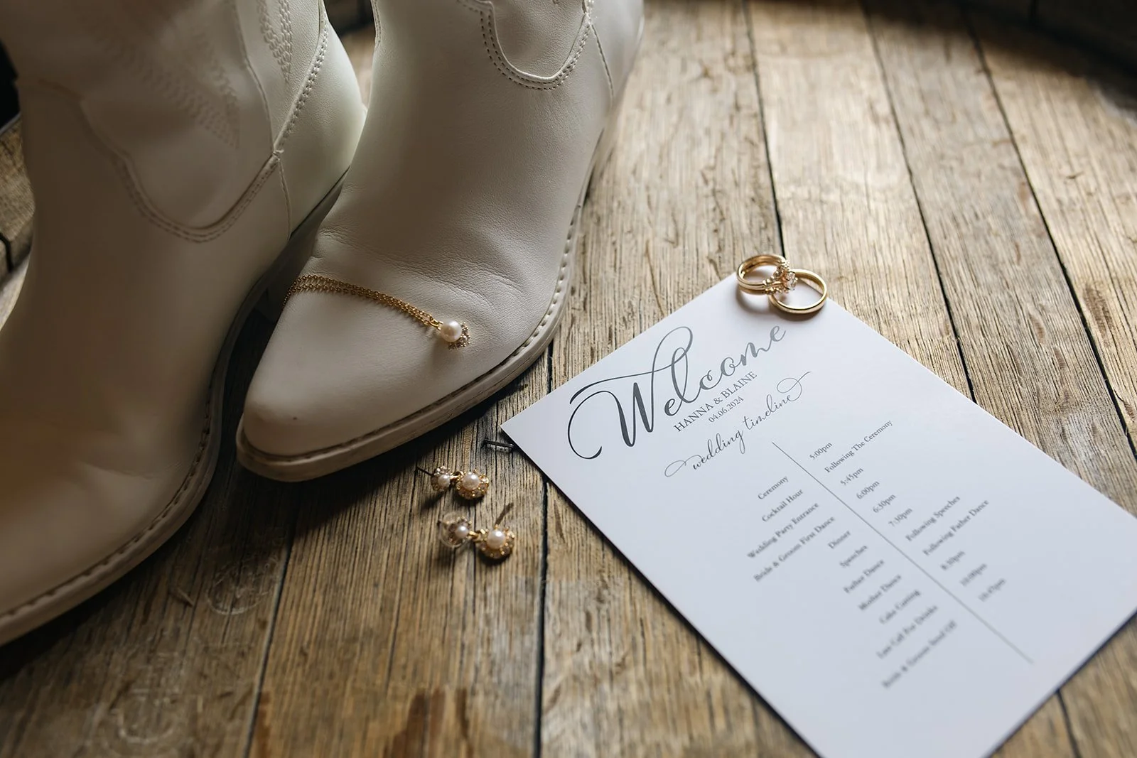 Wedding Detail Photos with boots and jewelry laid out on a wood floor