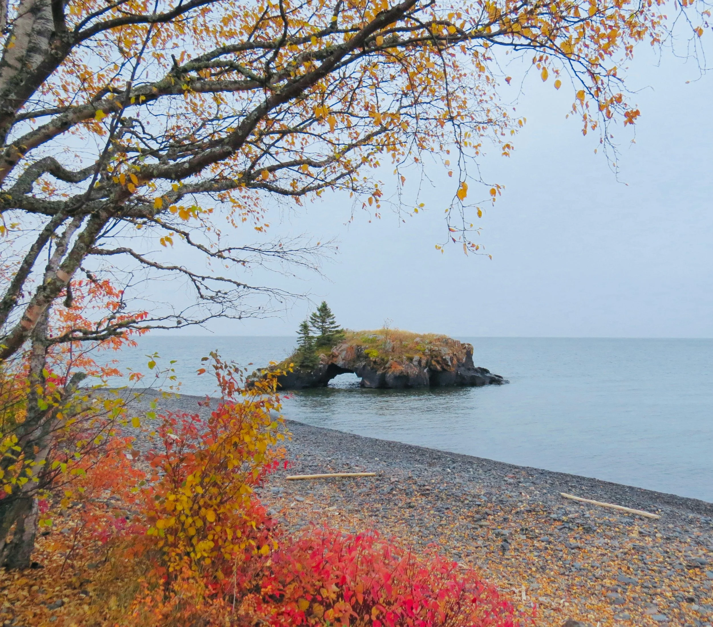 A small rock island on a lake
